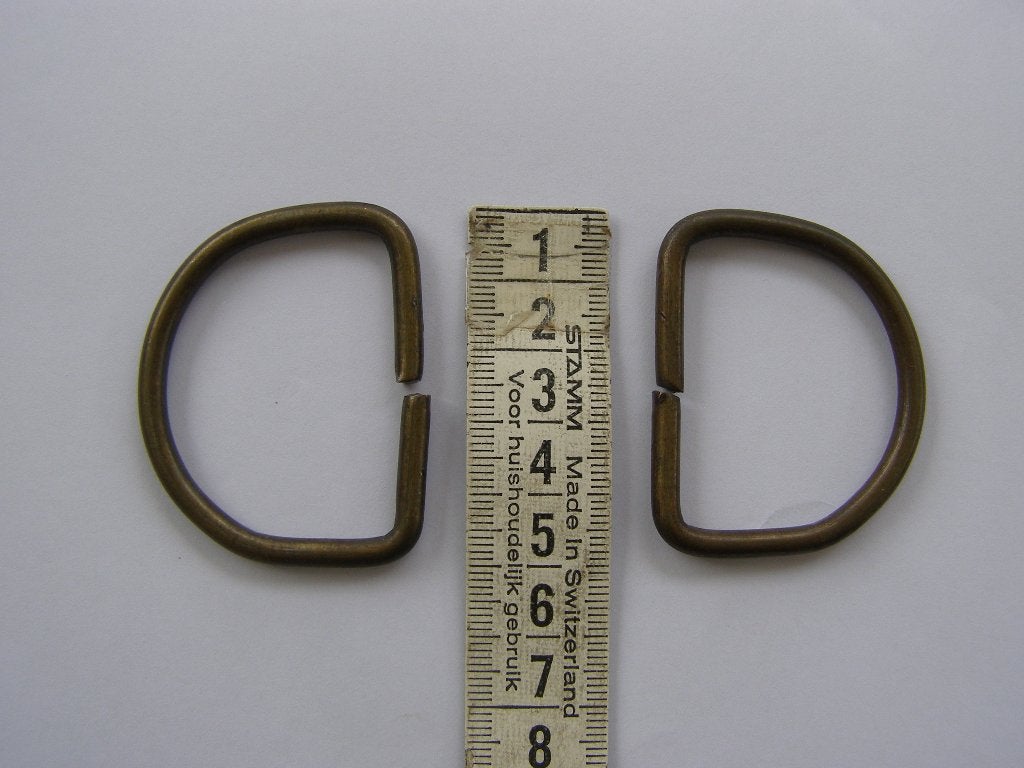 2 Metalen D-ringen, bronskleurig; 5 cm., Ophalen of Verzenden, Gebruikt, Rits of Sluiting