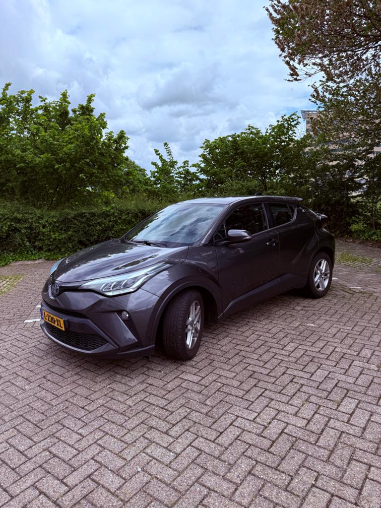 Toyota C-HR Business 1.8 Hybrid 122pk CVT 2020 Grijs, Auto's, Toyota, Euro 5, Stof, 725 kg, Zwart