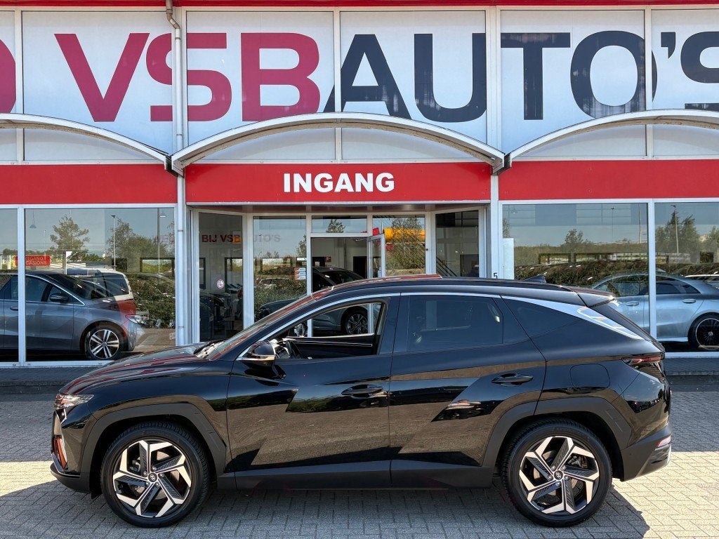 Hyundai TUCSON 1.6 T-GDI AUT. PHEV 4WD 265PK PANO-DAK LEER N, Auto's, Automaat, USB, Gebruikt, Huisgarantie