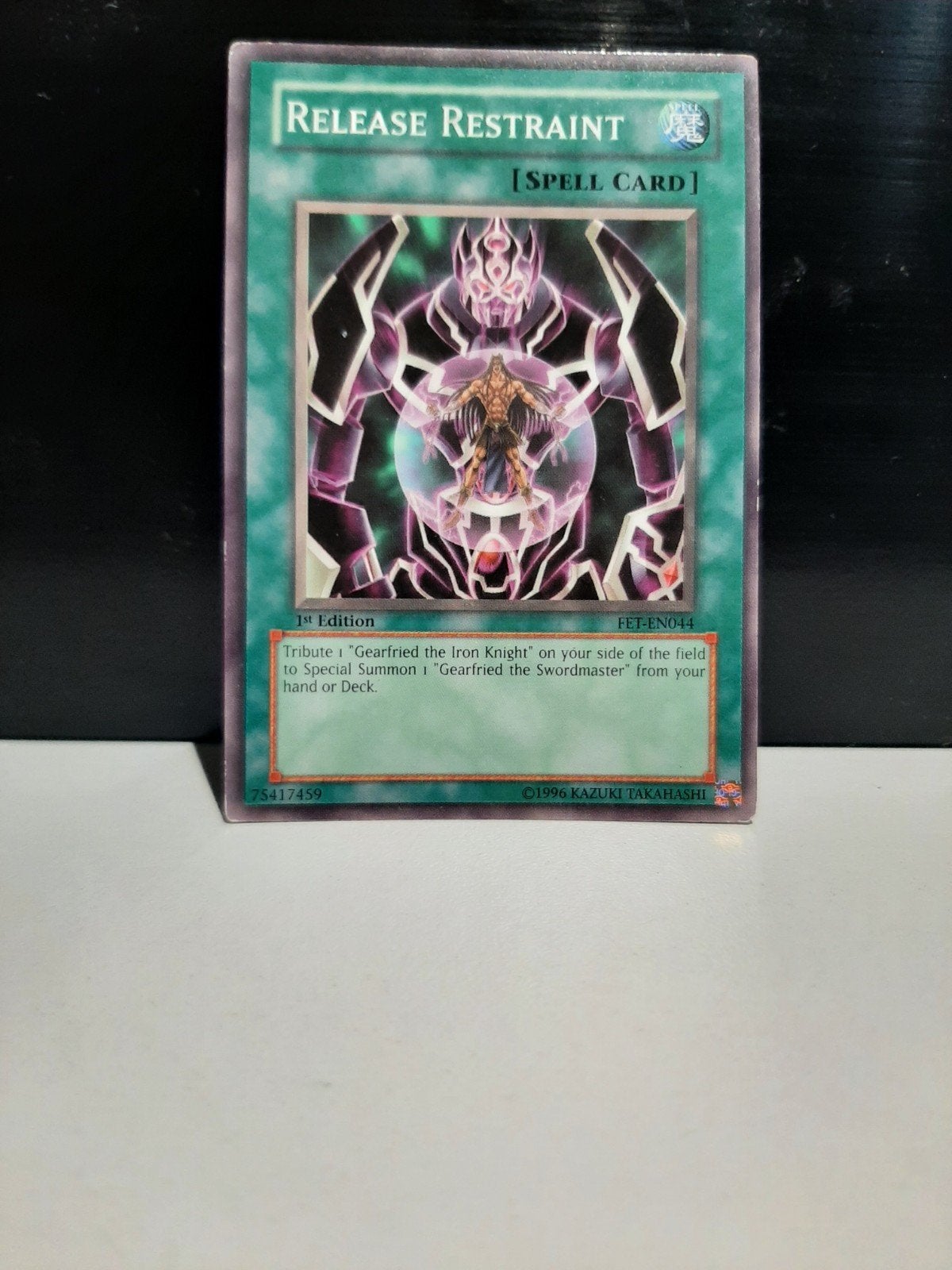 Yu-Gi-Oh! Release Restraint FET-EN044 1st Edition Spell Card, Ophalen of Verzenden, Gebruikt, Losse kaart