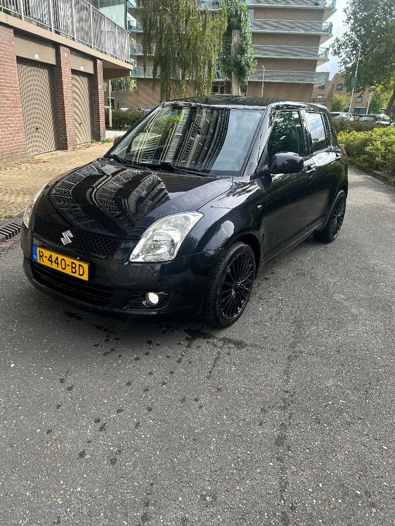 Suzuki Swift 1.3 5D 2009 Zwart, Auto's, Voorwielaandrijving, Stof, 40 €/maand, 400 kg