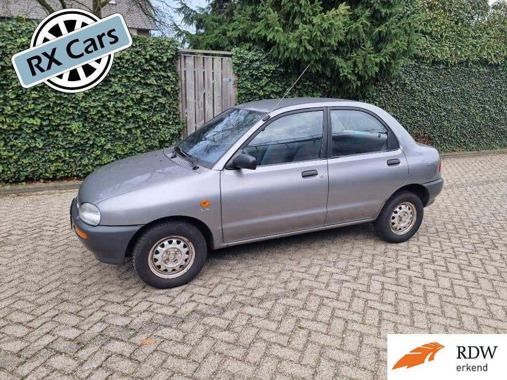 ❗Nette Mazda 121 1.3 I 16V NIEUWE APK✅ Bolhoed 1991 Grijs❗, Auto's, Mazda, Voorwielaandrijving, Stof, 54 pk, 4 cilinders