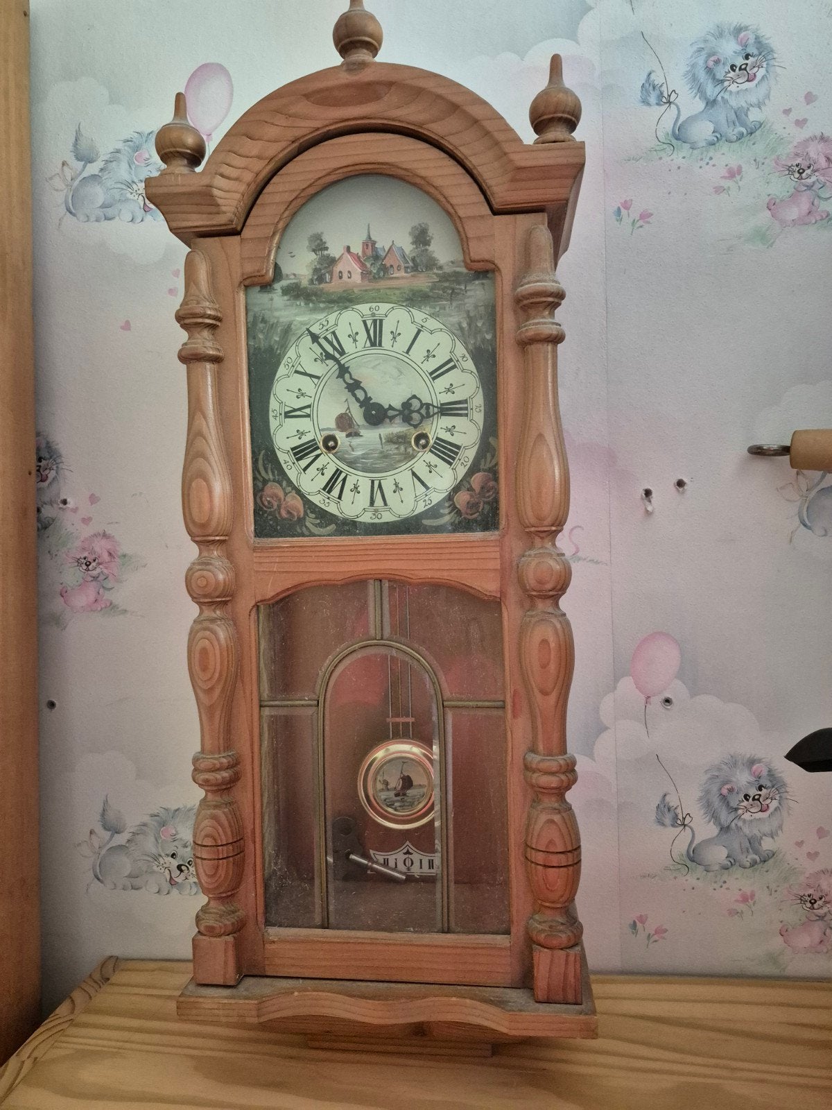 houten hangklok met slinger, Ophalen