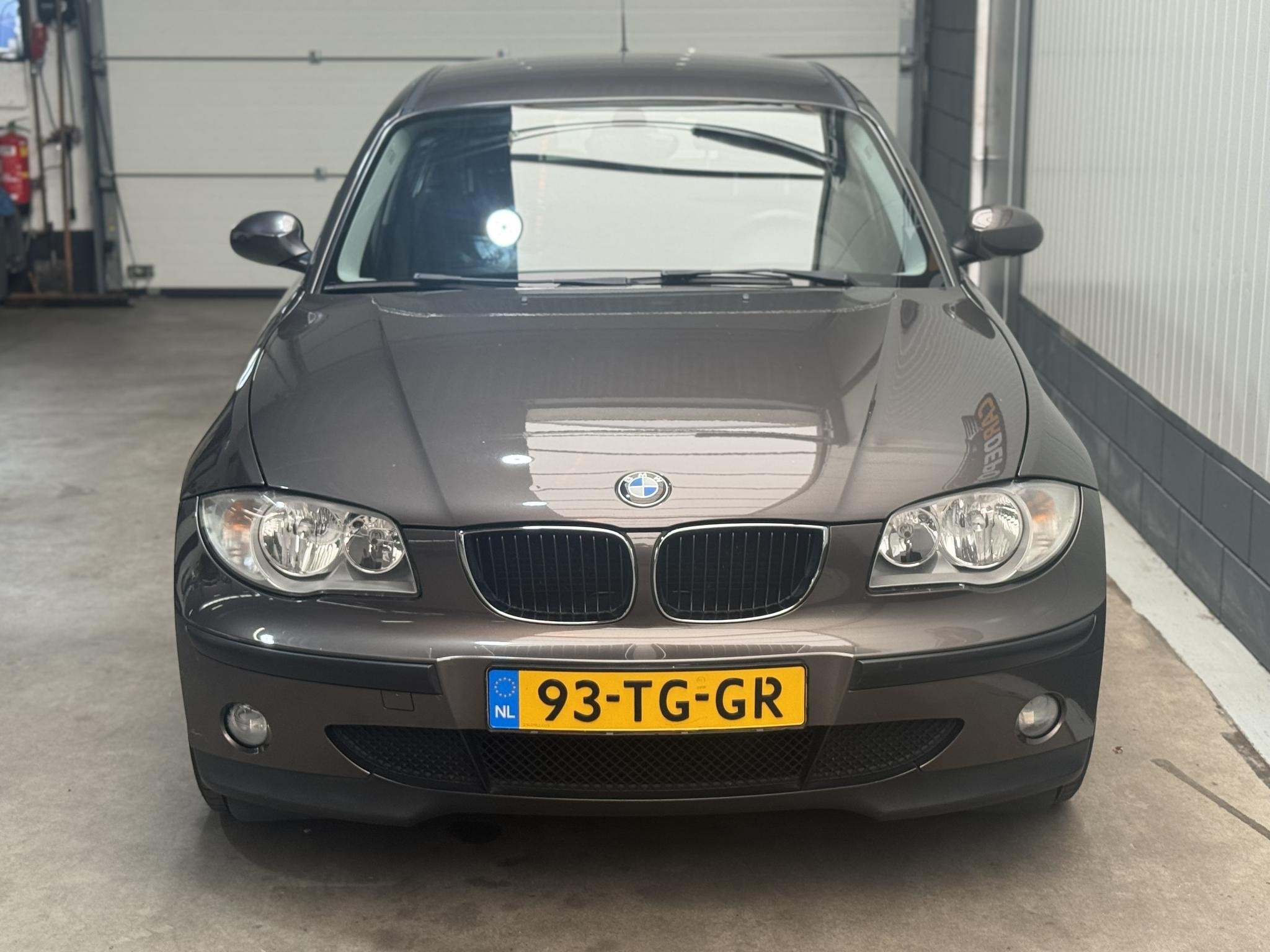 BMW 1-serie 116i Business Line, Auto's, Gebruikt, Zwart, 4 cilinders, Bruin