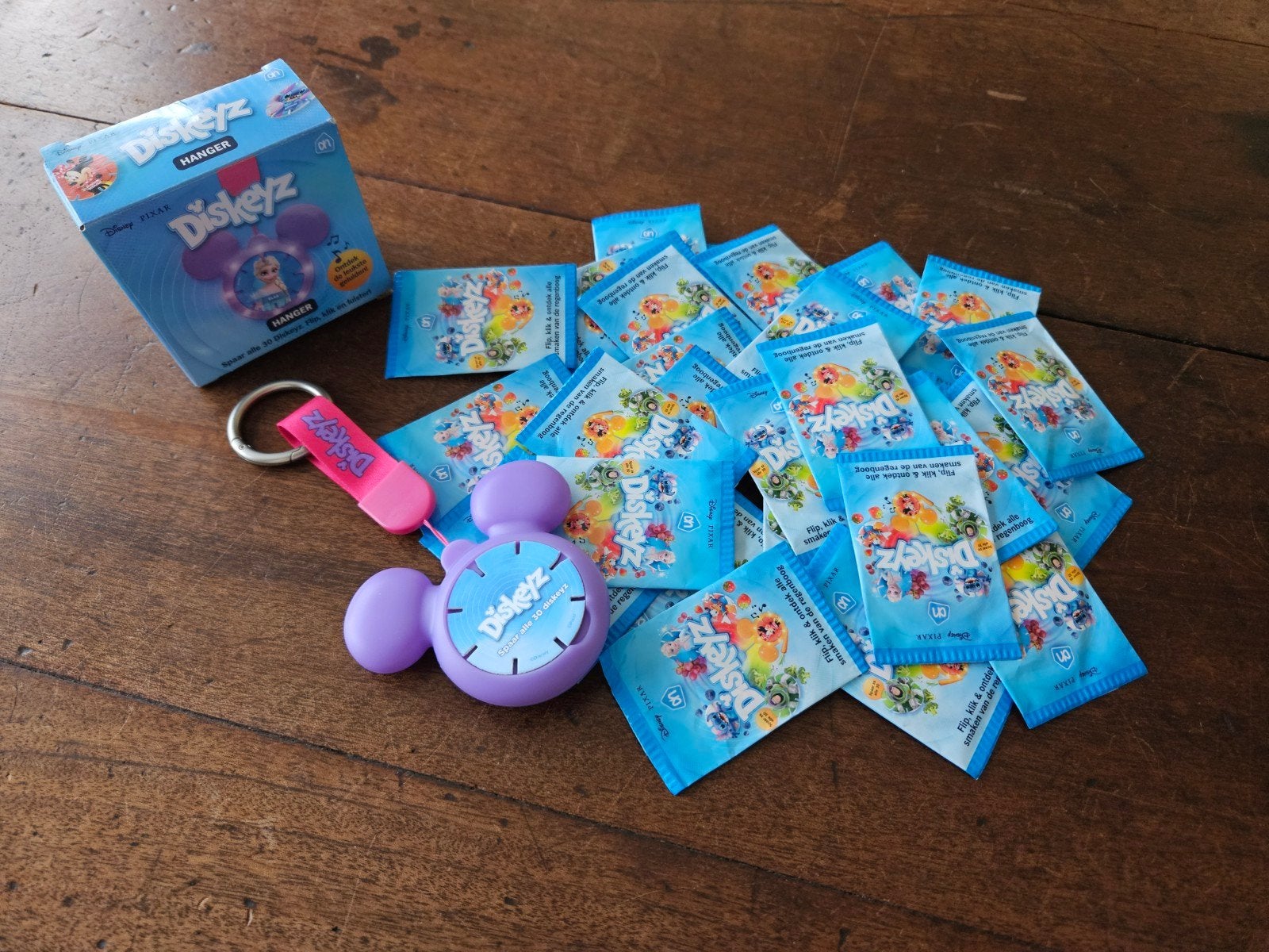 33 ongeopende Diskeyz pakjes met nieuwe paarse hanger, Albert Heijn, Ophalen of Verzenden
