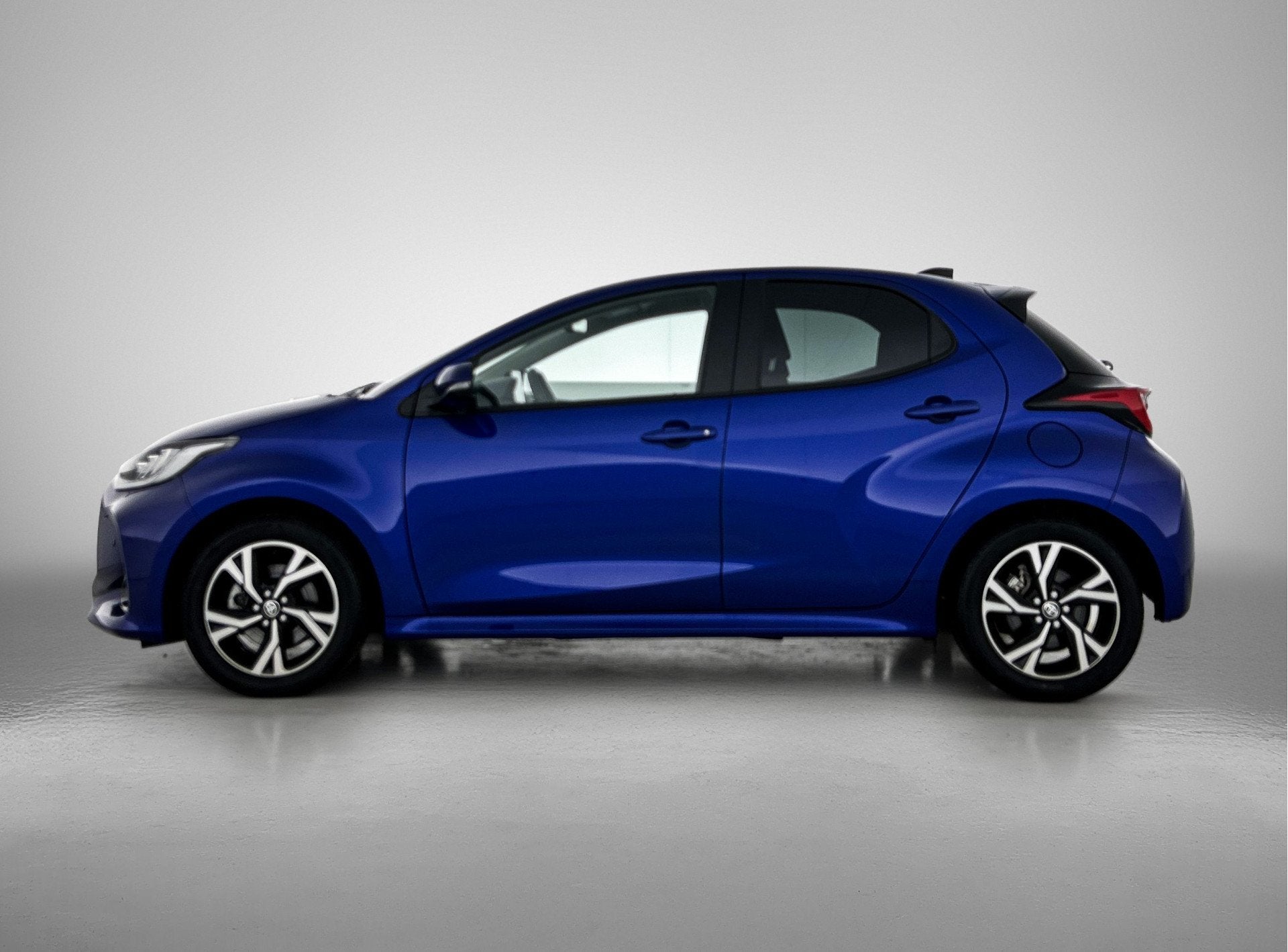 Toyota Yaris 1.5 Hybrid 115 Dynamic Comfort Pack | BTW voert, 12 maanden, Gebruikt, Blauw, Hybride Elektrisch/Benzine