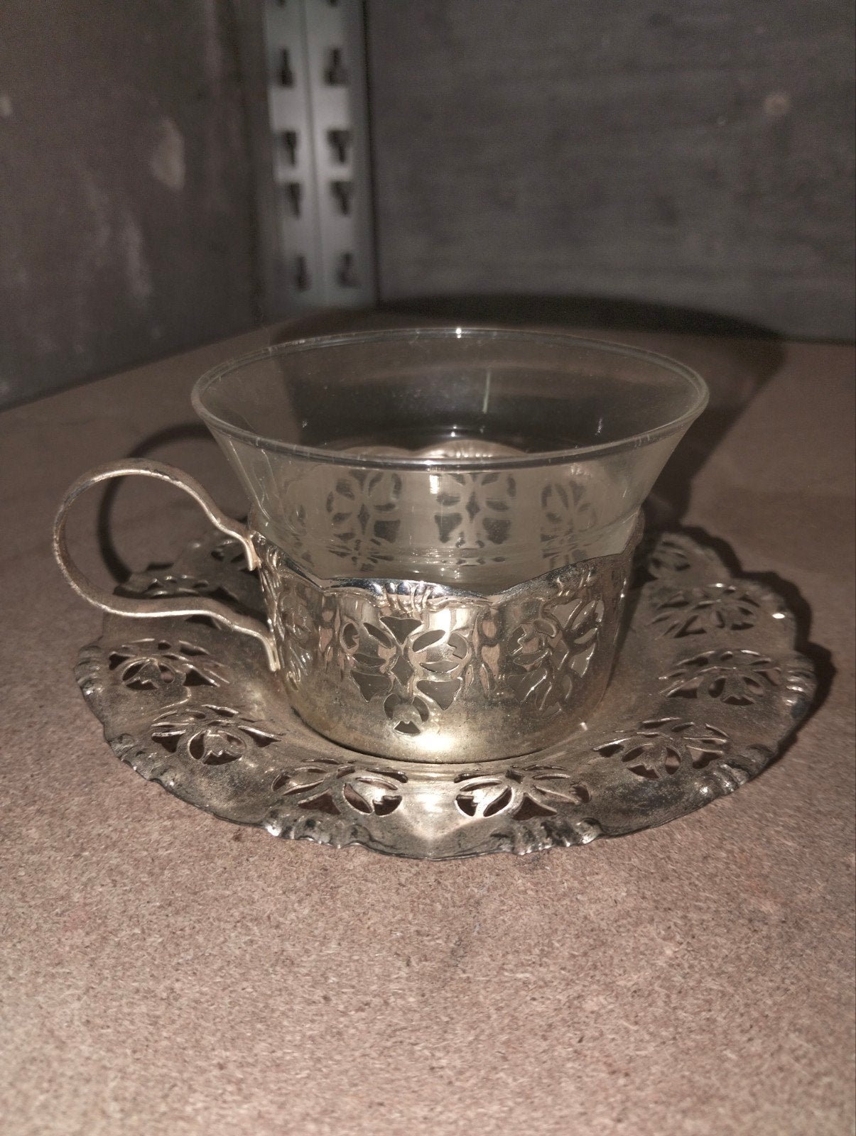 Vintage theekopje met zilveren houder en schotel, Ophalen of Verzenden