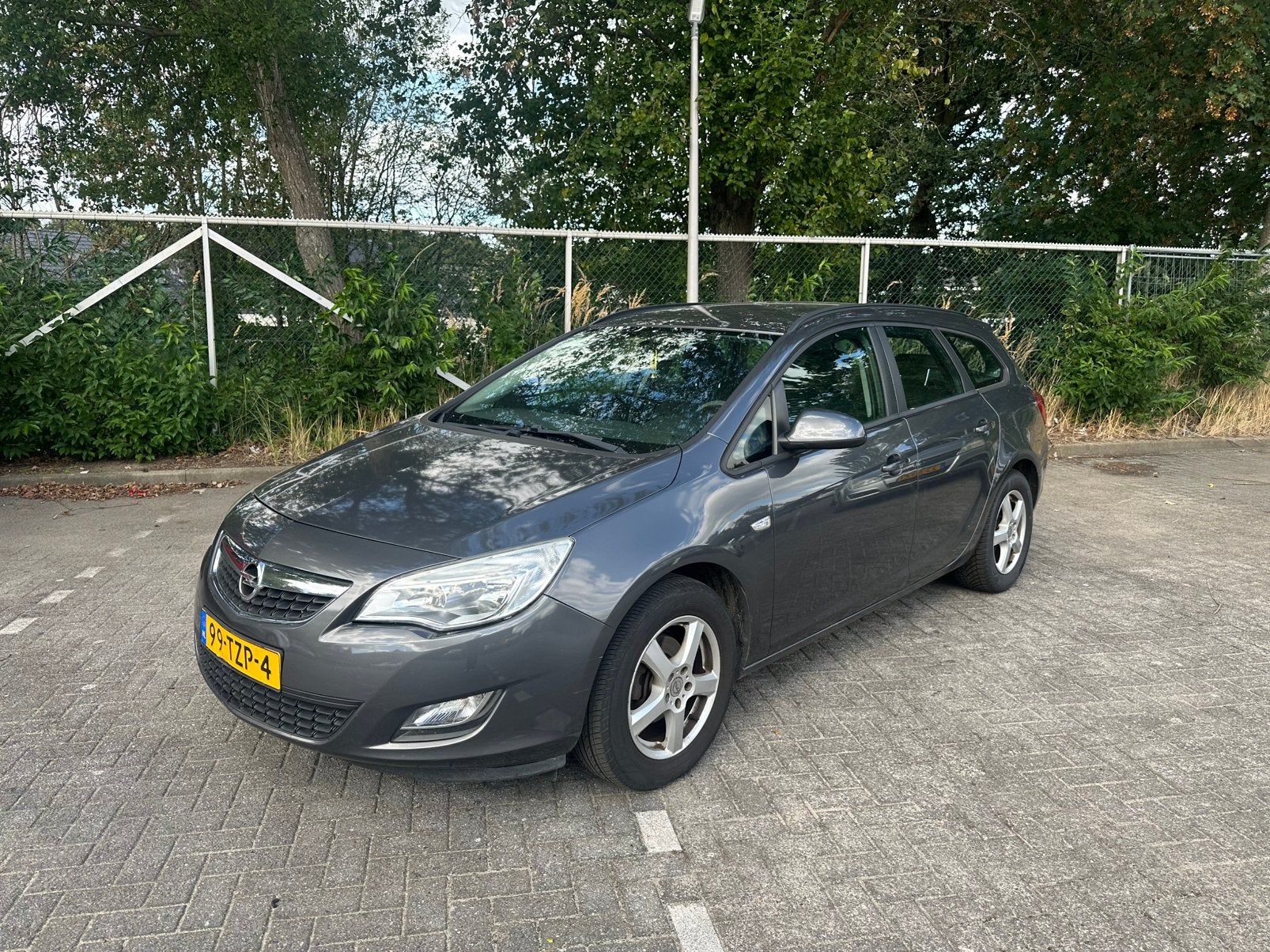 Opel Astra 1.4 74KW ST 2012 Grijs, Auto's, Opel, Voorwielaandrijving, 4 cilinders, 100 pk, Origineel Nederlands