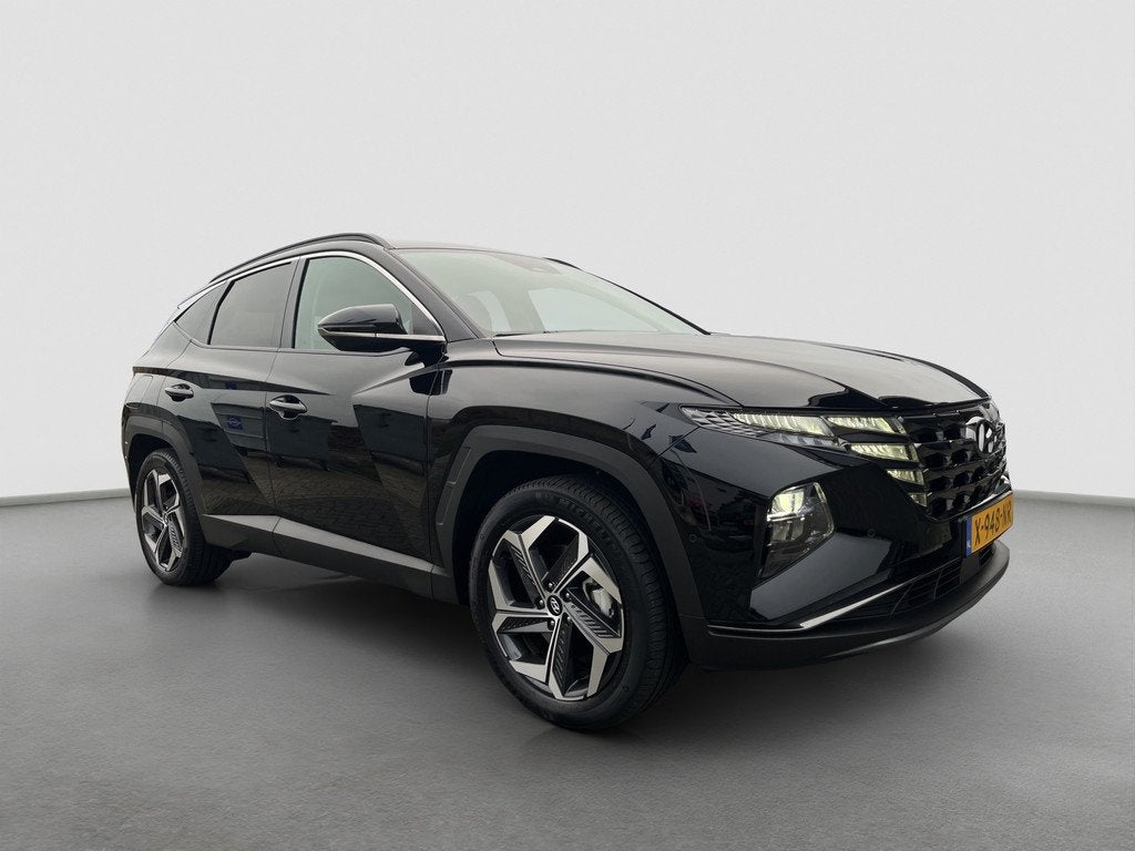 Hyundai TUCSON 1.6 T-GDI 265pk PHEV Premium 4WD, Auto's, Gebruikt, Zwart, Bedrijf, Vierwielaandrijving