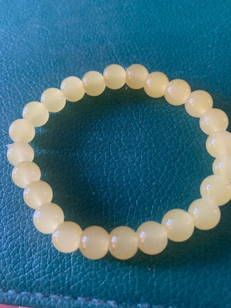 Geel kralen Armbandje, Sieraden, Tassen en Uiterlijk, Armbanden, Ophalen of Verzenden, Zo goed als nieuw, Geel, Elastiek
