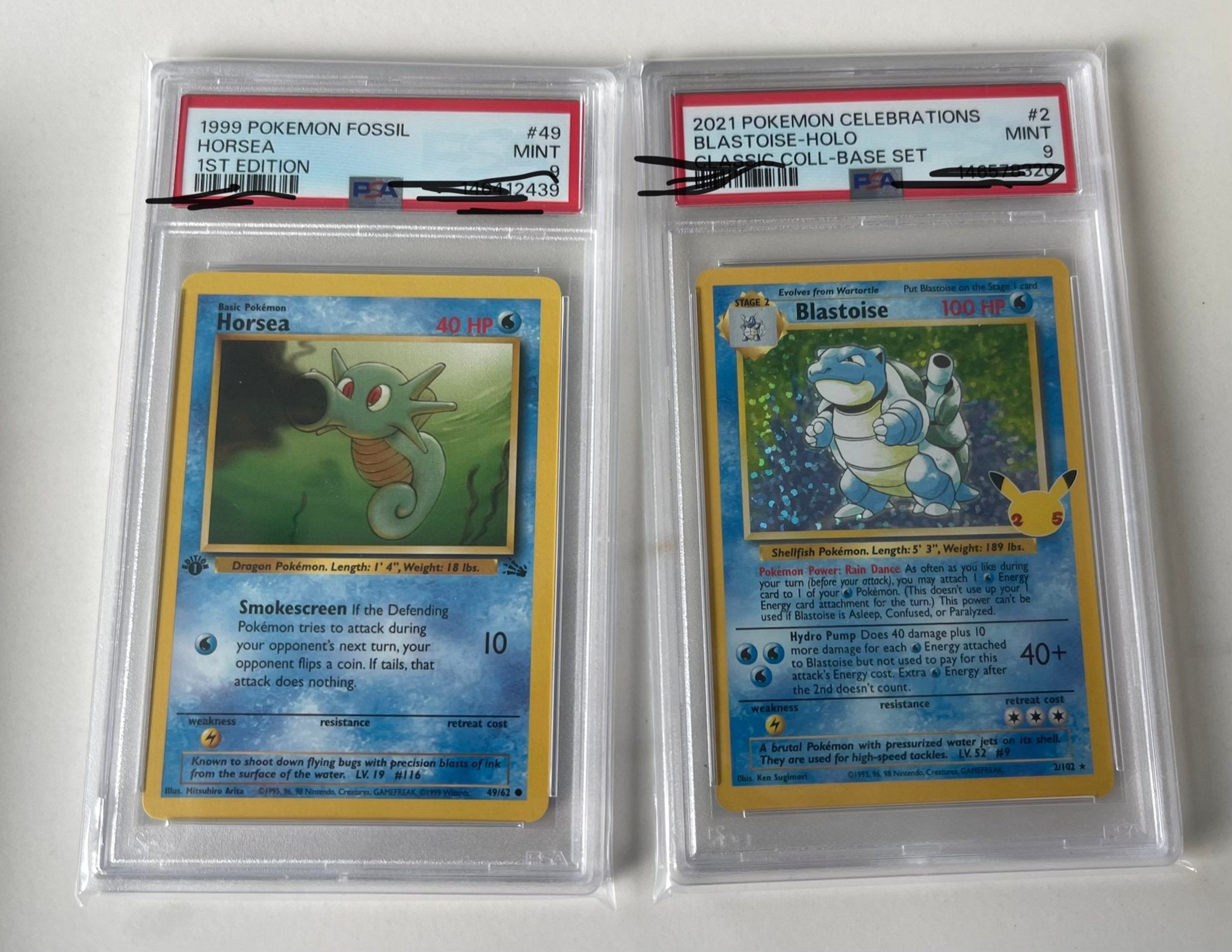 Pokémon PSA 9 Horsea 1st Editn & Blastoise Celebations Holo, Ophalen of Verzenden, Zo goed als nieuw, Meerdere kaarten
