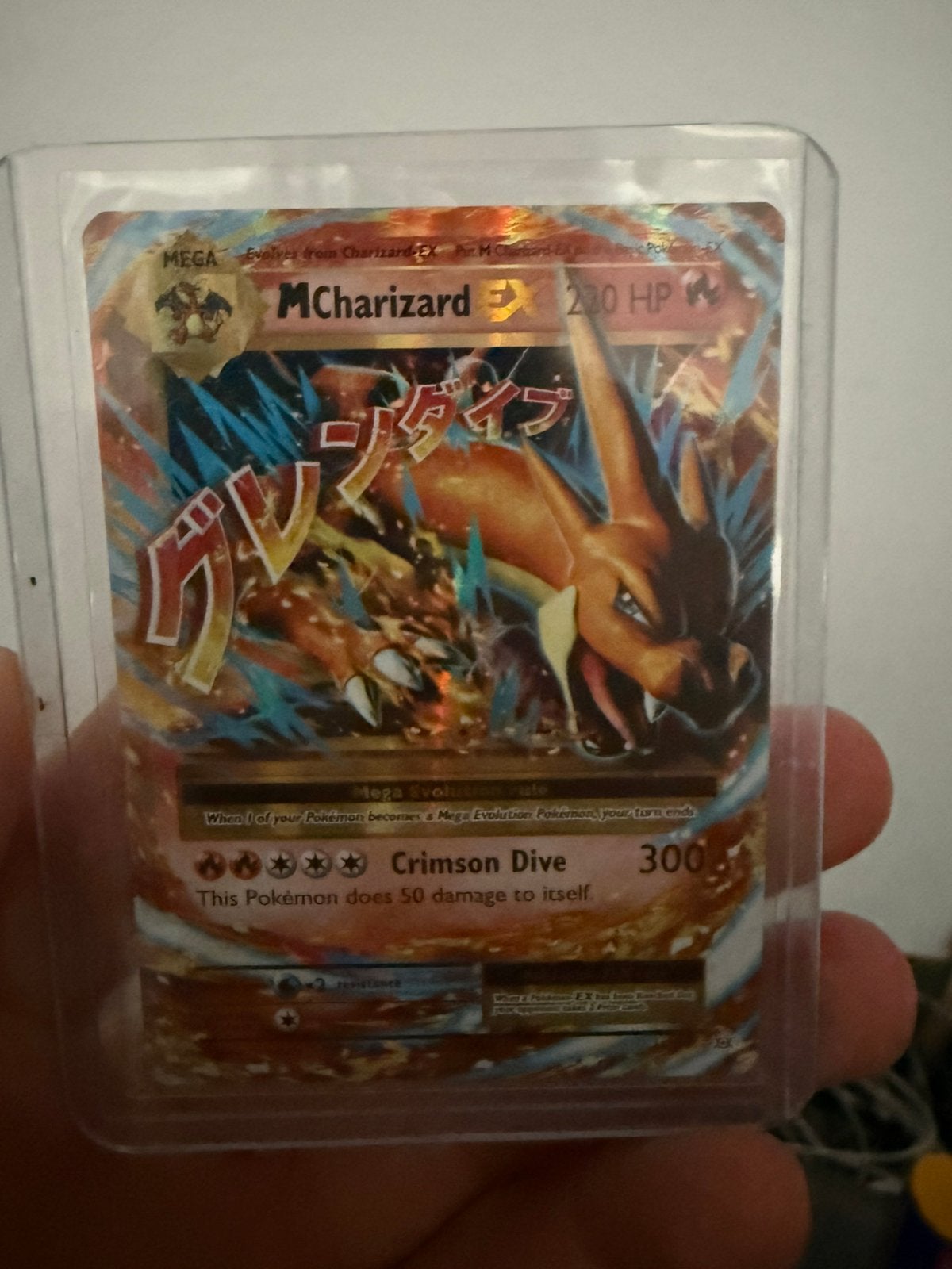 M charizard ex, Ophalen of Verzenden, Zo goed als nieuw