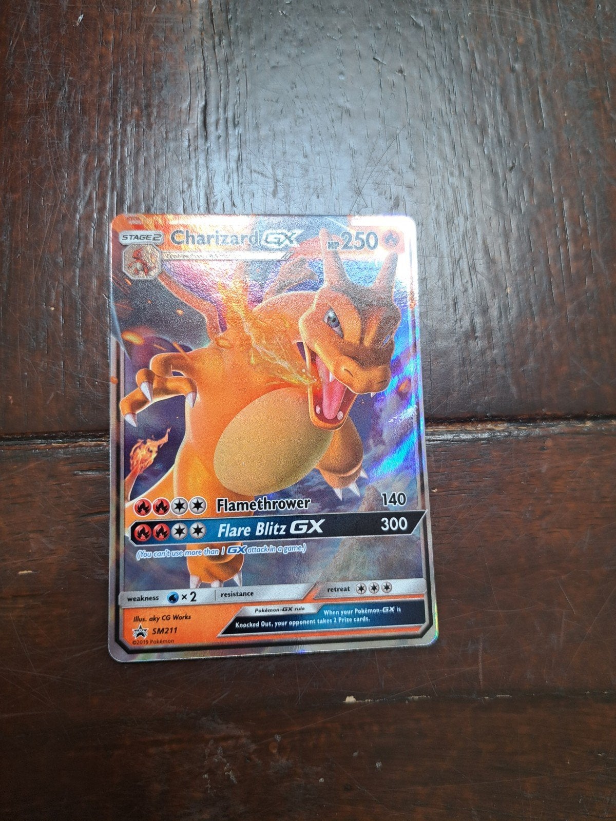 Charizard GX SM211, Hobby en Vrije tijd, Ophalen of Verzenden, Zo goed als nieuw, Losse kaart, Foil
