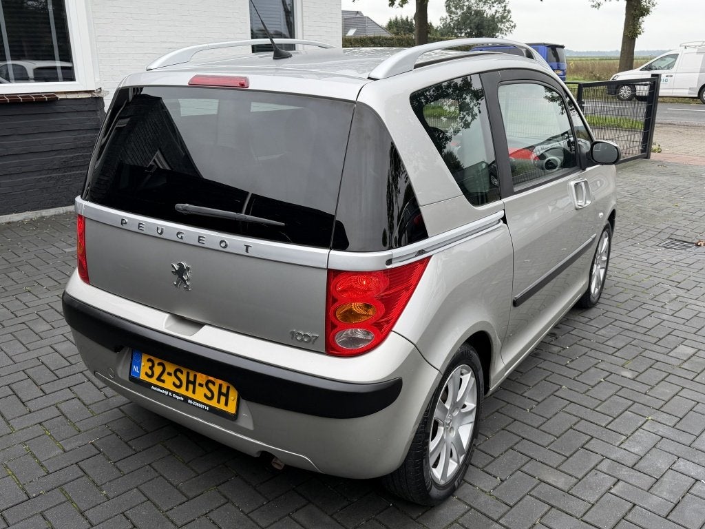 Peugeot 1007 1.4 Gentry| GRIJS| 167DKM NAP| CLIMA| CRUISE| L, Auto's, Stof, Verwarmde buitenspiegels, 4 cilinders, 4 stoelen