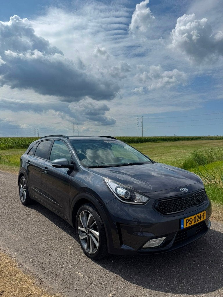 Kia Niro 1.6 GDi Hybrid Executive line + trekhaak, Auto's, Zwart, 1580 cc, 23 km/l, 75 €/maand
