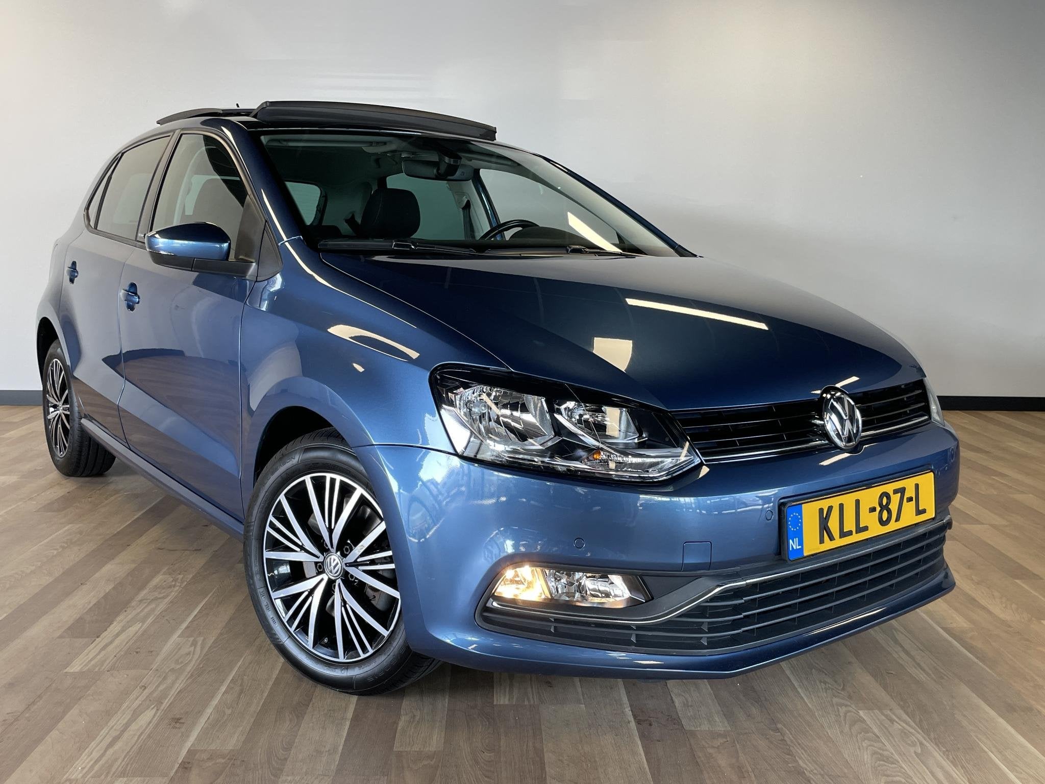 Volkswagen Polo 1.0 TSI Allstar, Auto's, Gebruikt, Euro 6, Blauw, Bedrijf