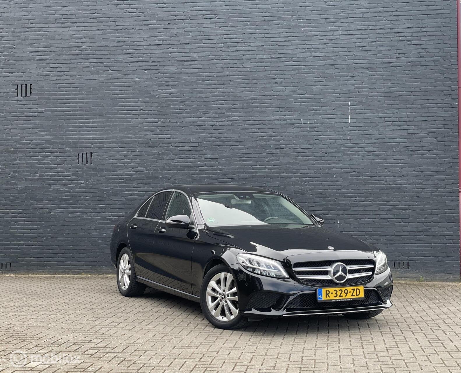 Mercedes-Benz C-klasse 180 156PK AUT 9-Tronic Facelift, Auto's, Mercedes-Benz, Leder en Stof, Zwart, 1595 cc, Sedan