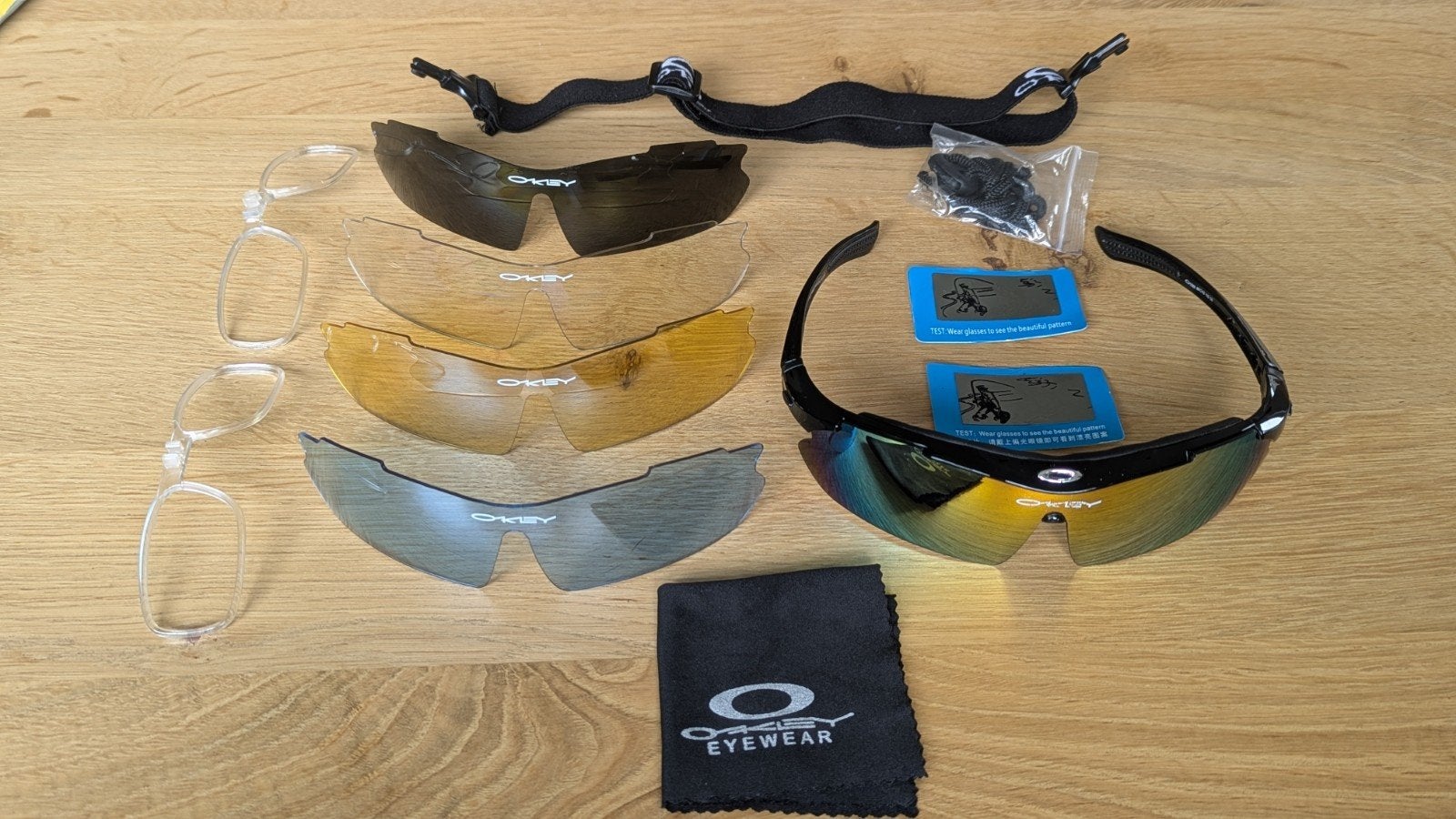 Oakley Zonnebril met verwisselbare lenzen en etui, Zonnebril, Verzenden, Zwart, Zo goed als nieuw