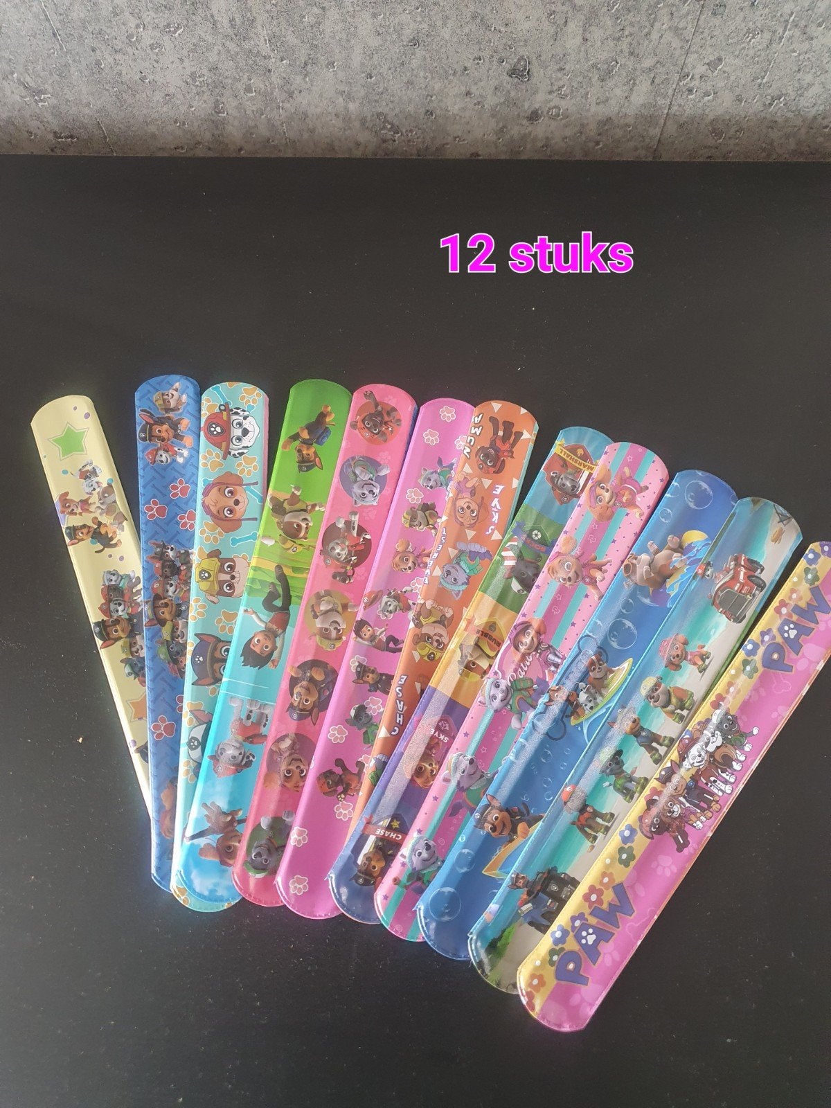12 nieuwe Paw Patrol klap armbandjes, Ophalen of Verzenden, Nieuw