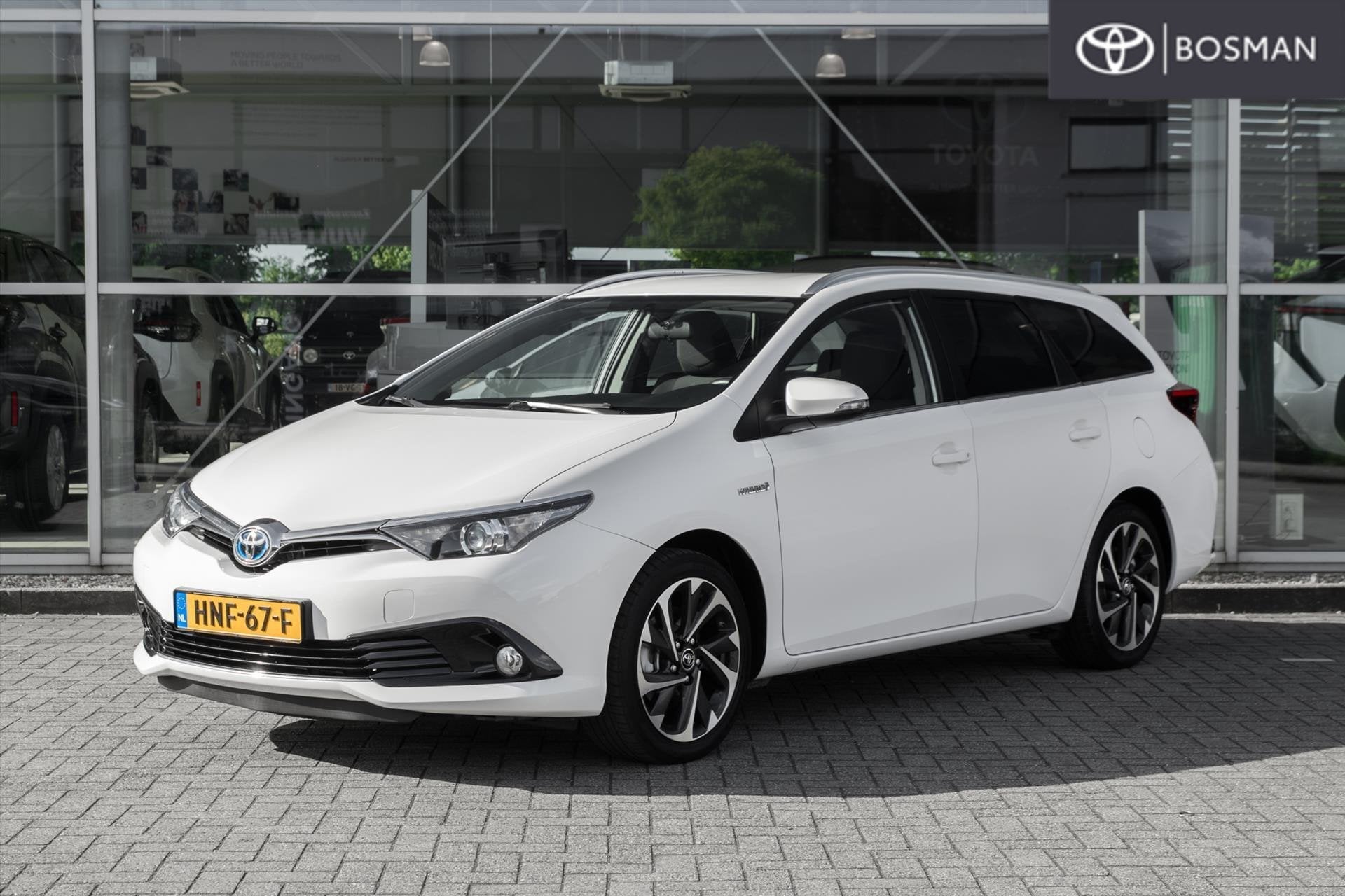 Toyota Auris 1.8 HYBRID TOURING SPORTS CVT, Auto's, Stof, Gebruikt, Euro 6, Wit