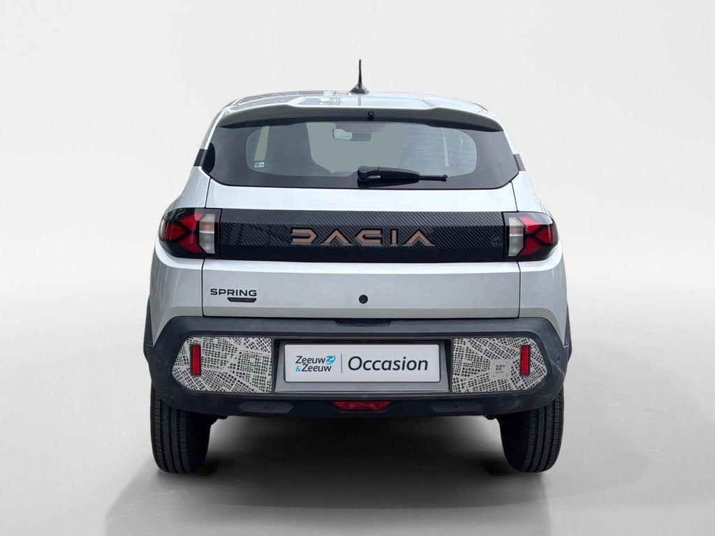Dacia Spring Extreme 65 26.8 kWh AUTOMAAT NAVI AIRCO CAMERA, Auto's, Dacia, 12 maanden, Gebruikt, 4 stoelen, Leder en Stof