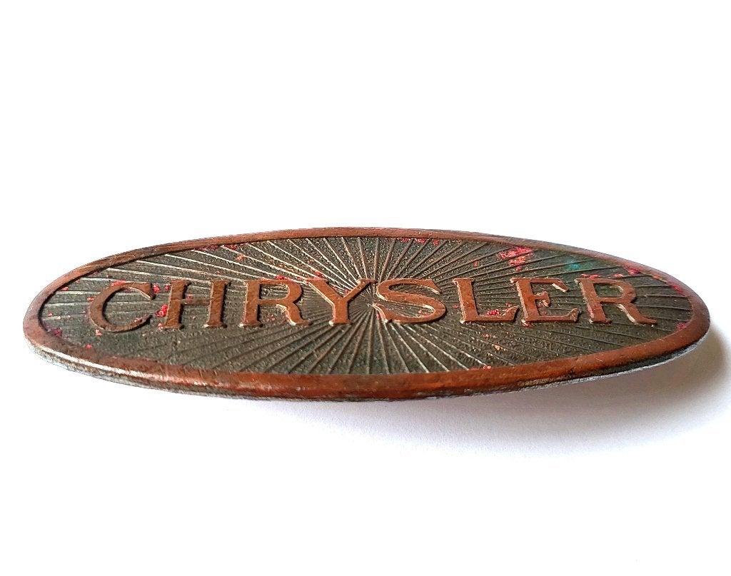 Origineel vintage Chrysler embleem. en nog oude auto boeken, Ophalen of Verzenden