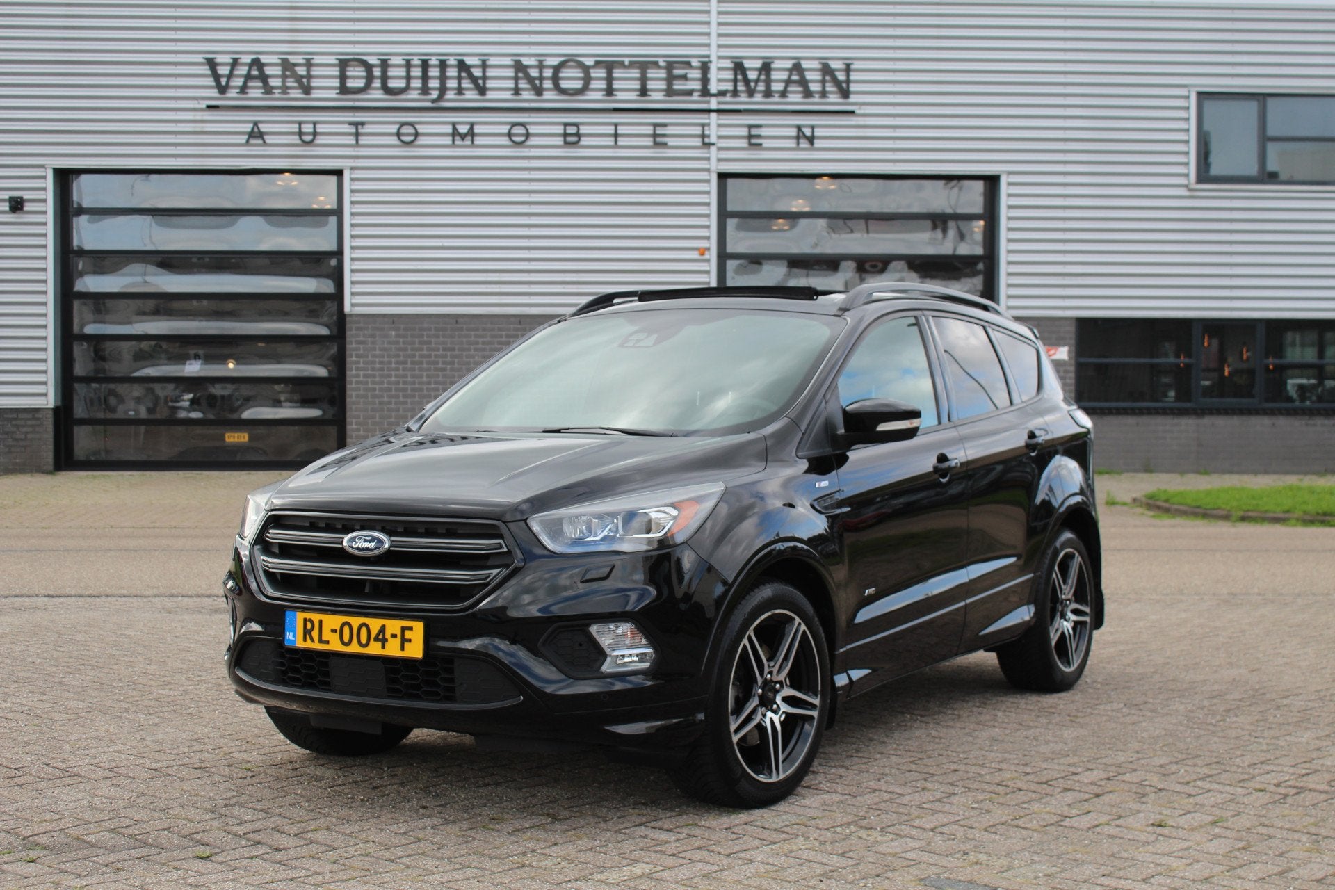 Ford Kuga 1.5 EcoBoost ST Line AWD / Panoramadak / Trekhaak, Auto's, 4 cilinders, Zwart, Bedrijf, Vierwielaandrijving