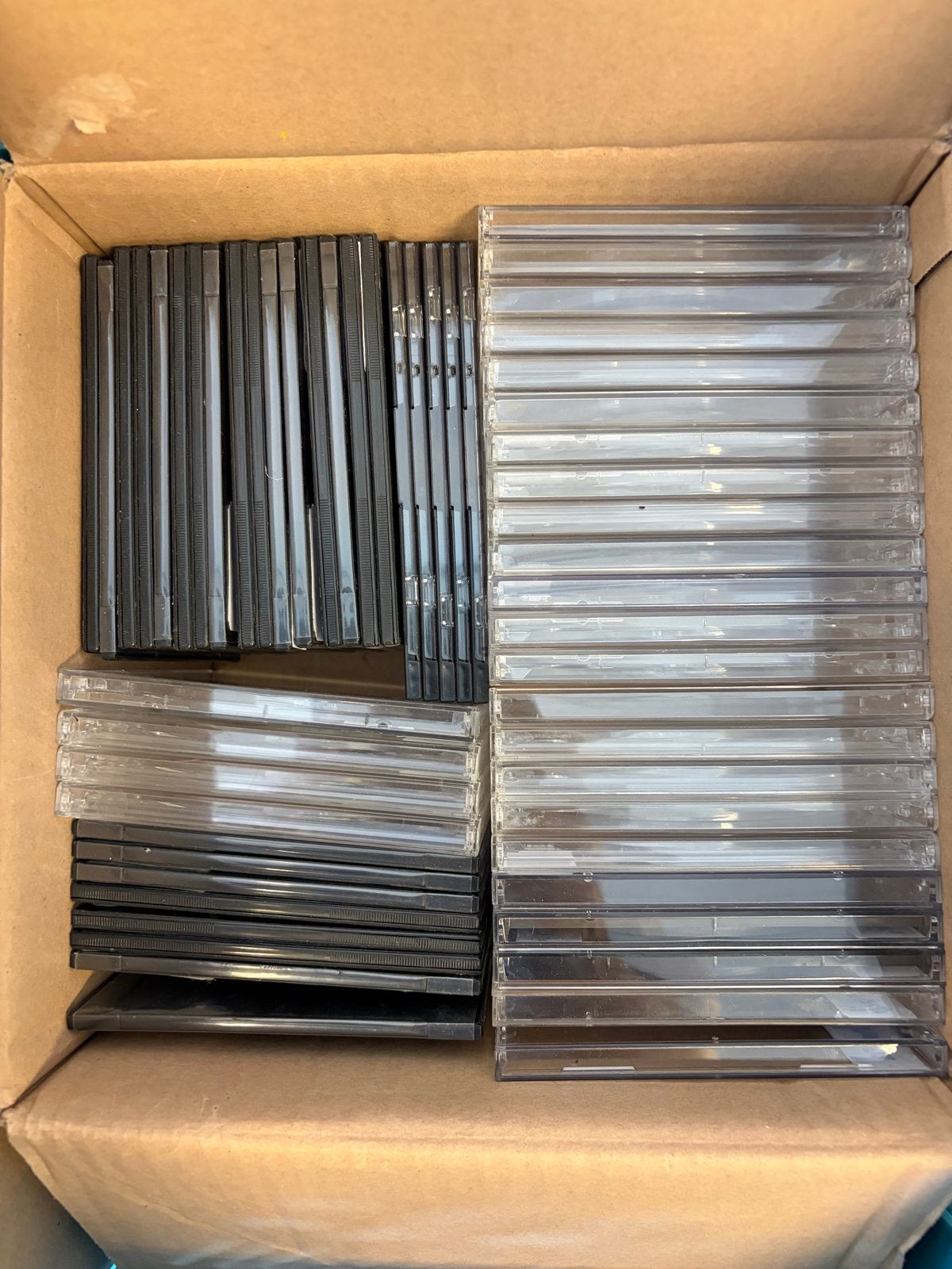 50 lege CD hoesjes - transparant en zwart, Ophalen, Gebruikt, Overige typen, Inclusief doosje