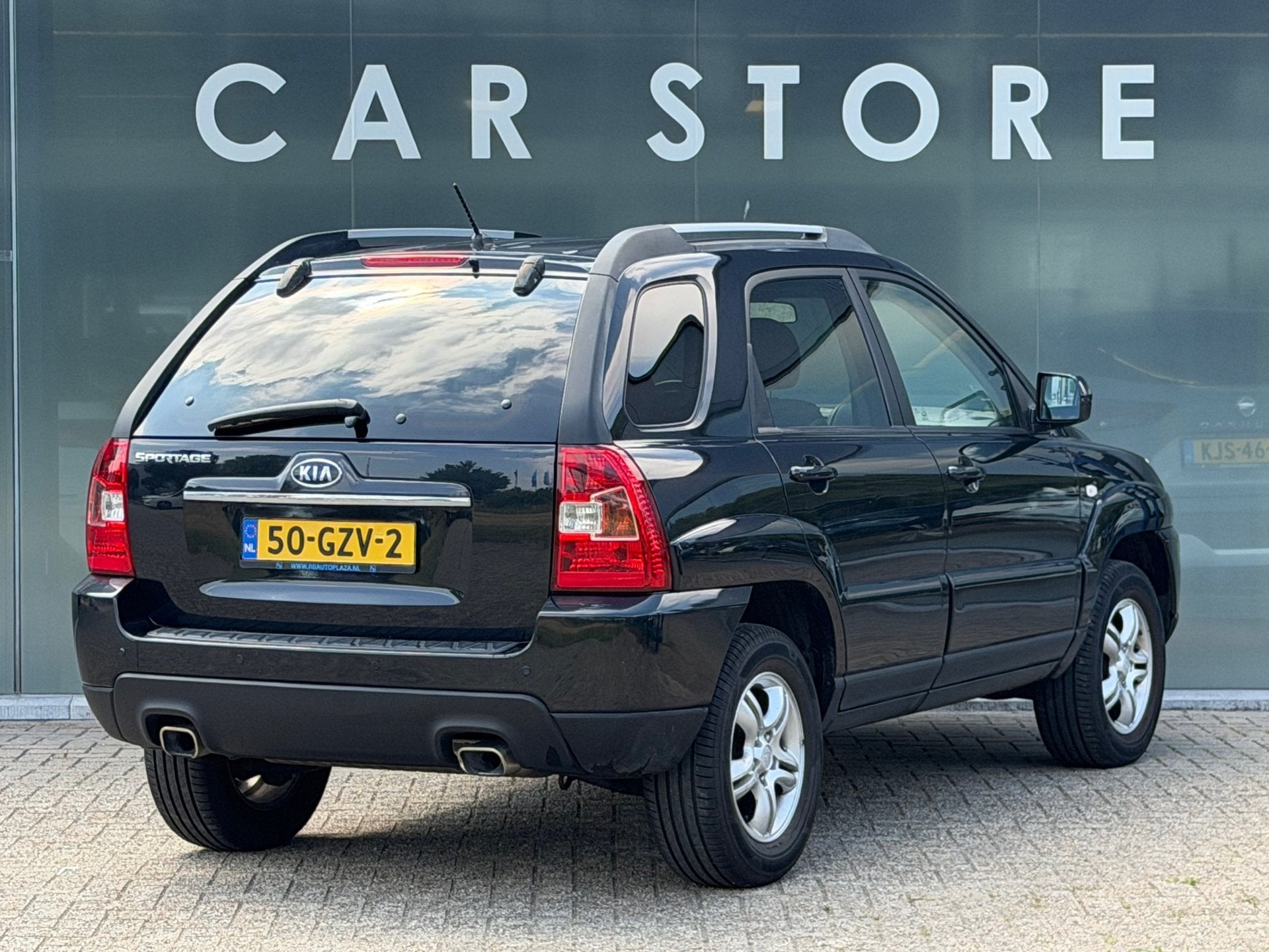 Kia Sportage 2.0 CVVT X-tra, Auto's, Kia, Stof, Gebruikt, Zwart, 4 cilinders