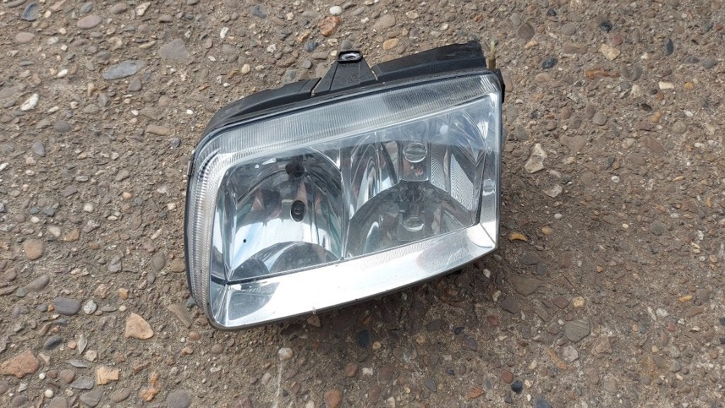 Linker koplamp Polo 2000, Ophalen of Verzenden