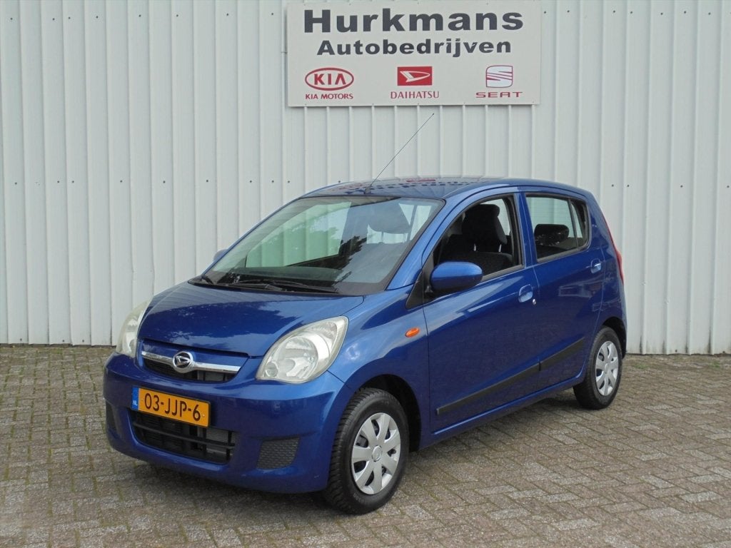 Daihatsu Cuore 1.0 69Pk 5drs Premium Automaat (bj 2009), Auto's, Automaat, 12 maanden, Stof, Zwart