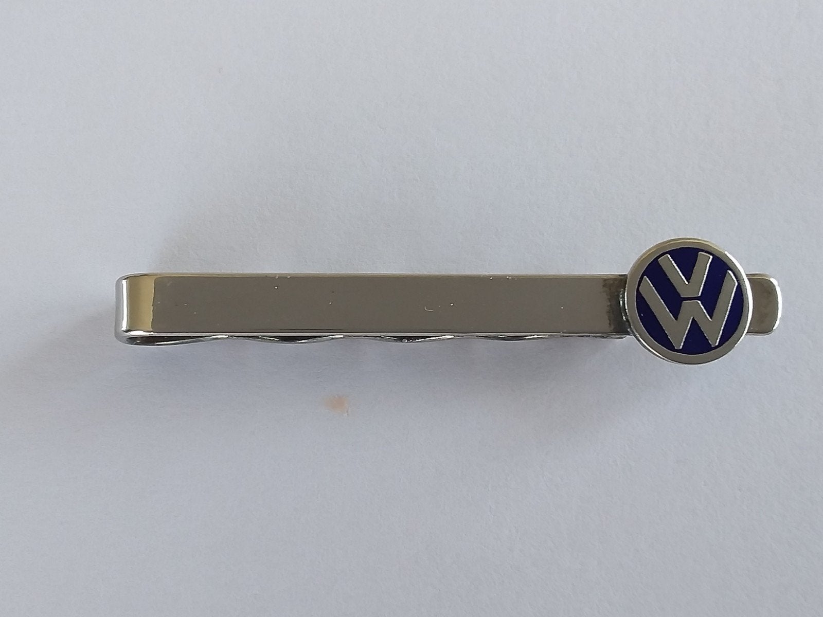 VW  ZILVER DASSPELD  LOGO BAKELIET / ZILVER, Ophalen of Verzenden