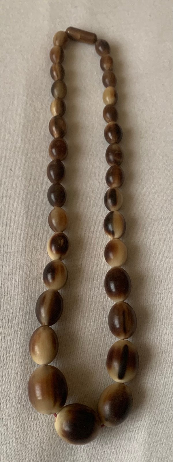 Oude bakeliet ketting met draaislot, Sieraden, Tassen en Uiterlijk, Antieke sieraden, Ophalen of Verzenden, Overige materialen