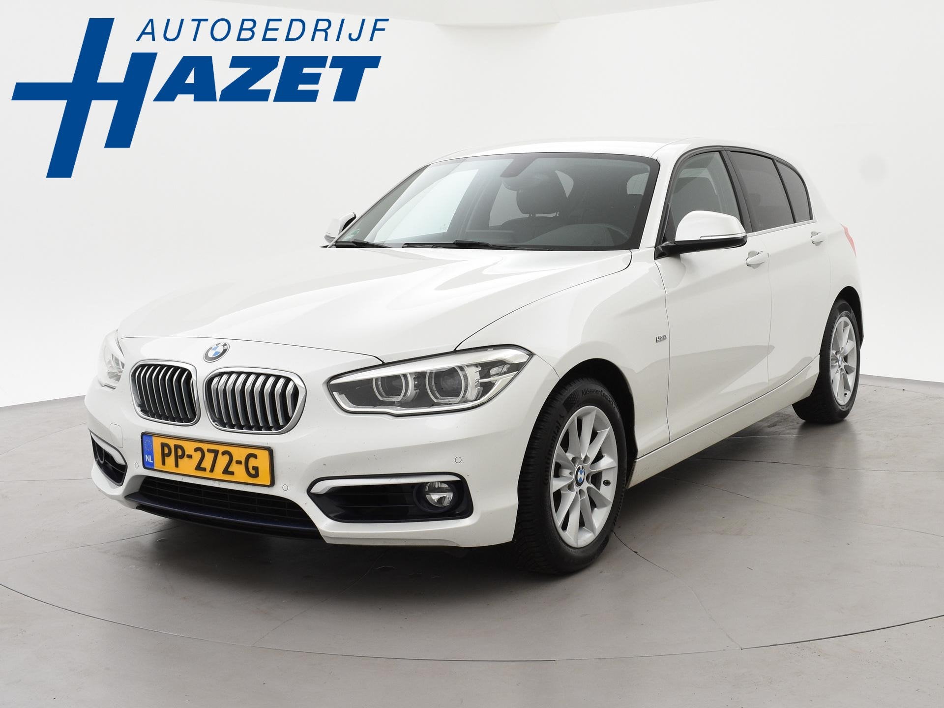 BMW 1-serie 120i 184 PK H.E. LUXURY AUT. + DRAADLOZE CARPLAY, Achterwielaandrijving, Gebruikt, 4 cilinders, Leder en Stof
