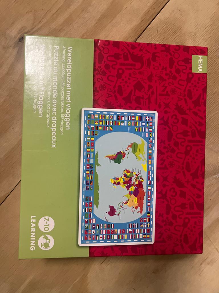 Hema Wereldpuzzel met vlaggen - 150 stukjes, Kinderen en Baby's, Speelgoed | Kinderpuzzels, Ophalen of Verzenden, Gebruikt, 6 jaar of ouder