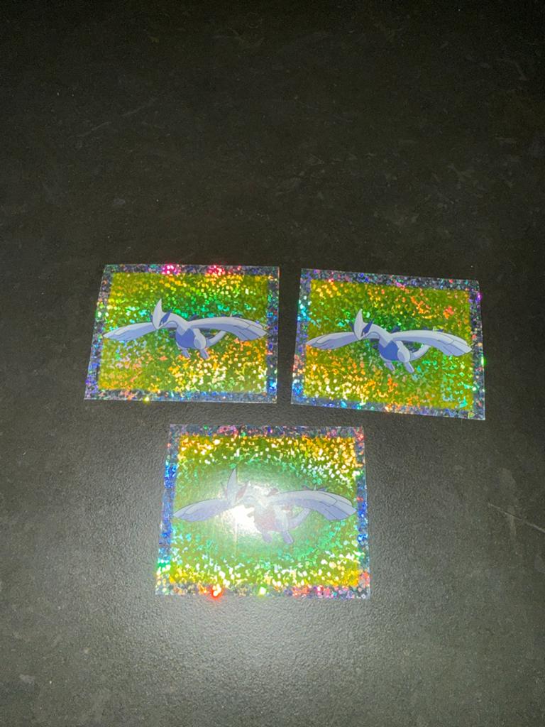 3x Lugia Pokémon Merlin Stickers - Holografisch, Ophalen of Verzenden, Zo goed als nieuw, Meerdere stickers