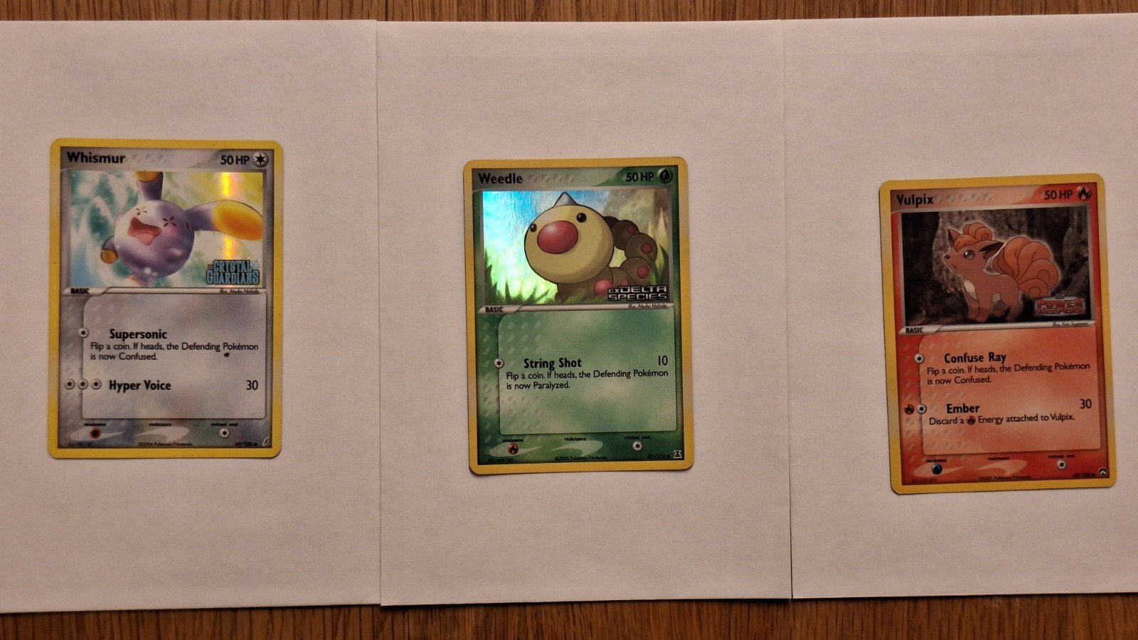 3 Stamped holo Pokemon kaarten. Vulpix, Whismur en Weedle, Ophalen of Verzenden, Zo goed als nieuw, Meerdere kaarten