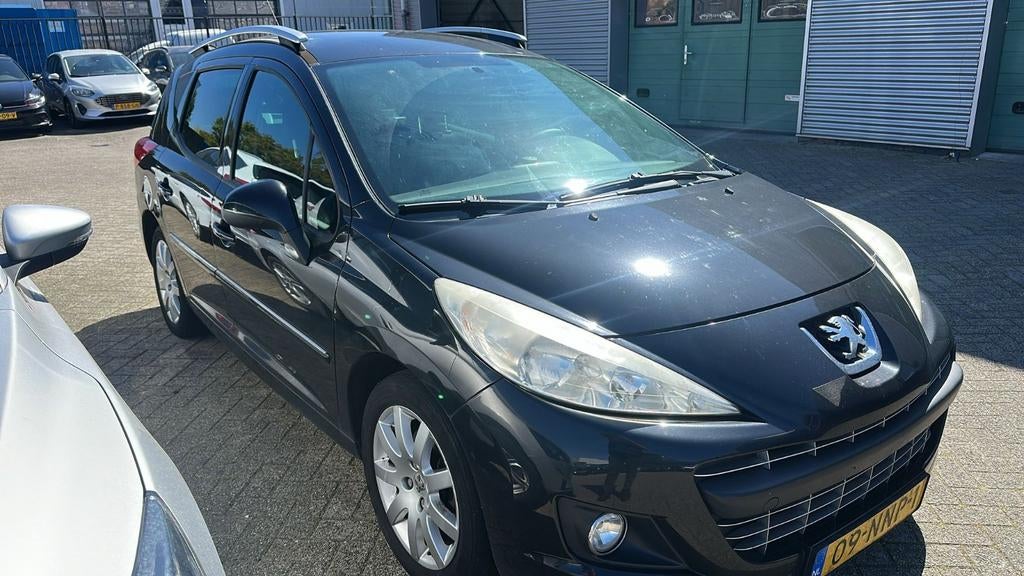 Peugeot 207 1.6 16V Vti  SW sportium Outdoor 2010 Zwart, Auto's, Voorwielaandrijving, Stof, Zwart, 4 cilinders