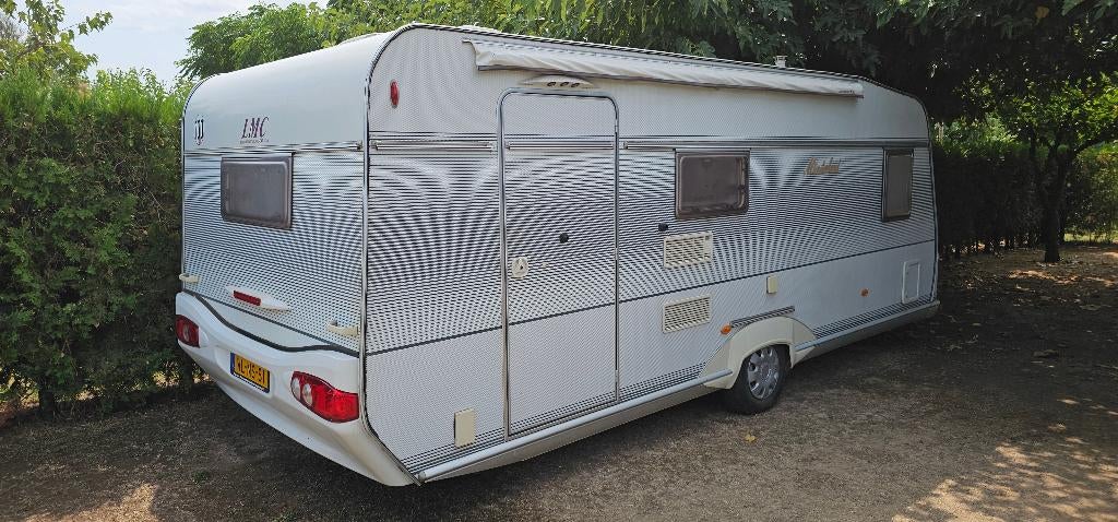 LMC Munsterland 560 MDK - Rolstoelvriendelijk / 250cm breed, Caravans en Kamperen, Caravans, Omvormbare zithoek, Treinzit, Particulier