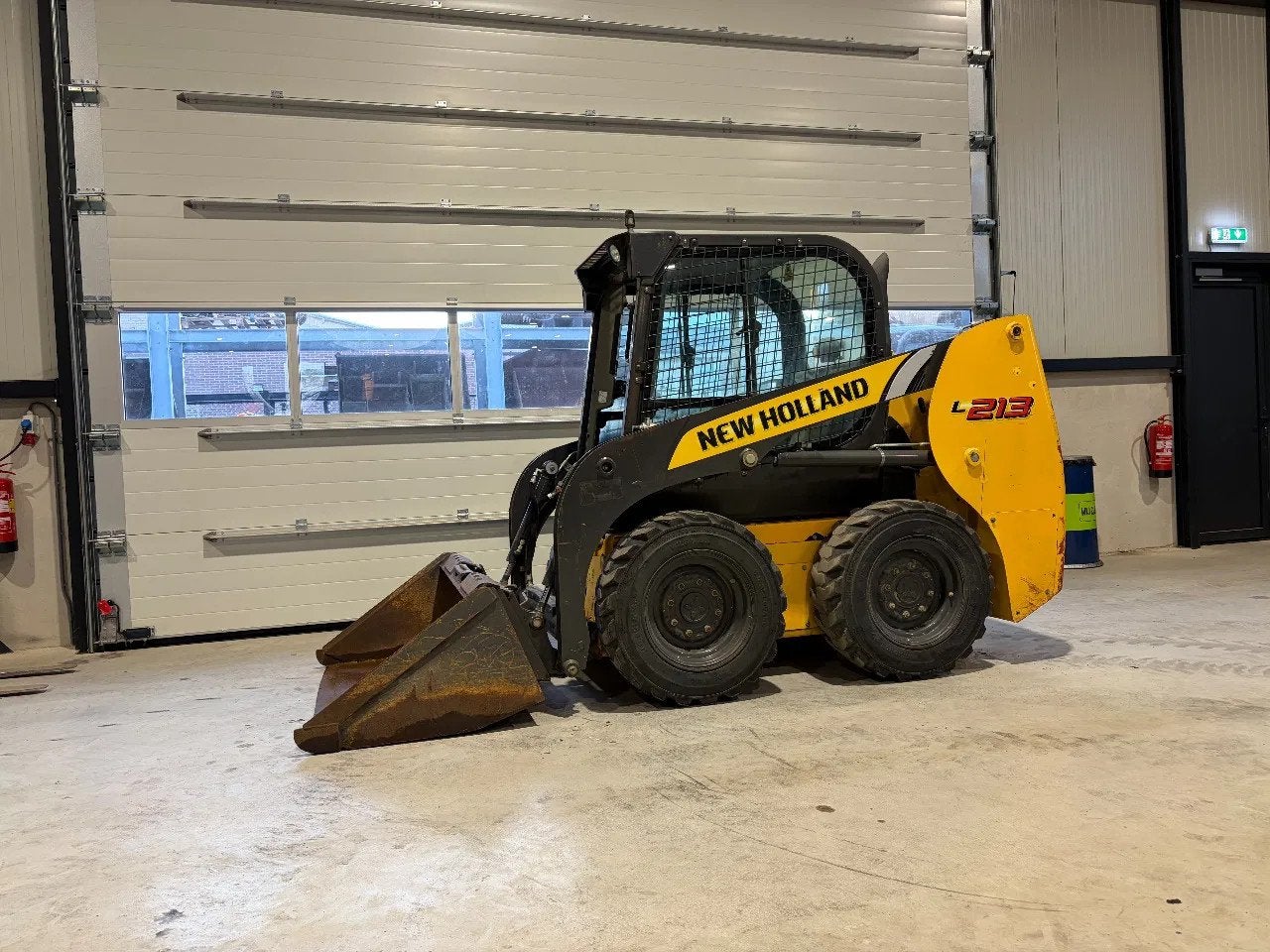 New Holland L213 schranklader/wiellader (bj 2018), Zakelijke goederen, Machines en Bouw | Kranen en Graafmachines, Wiellader of Shovel