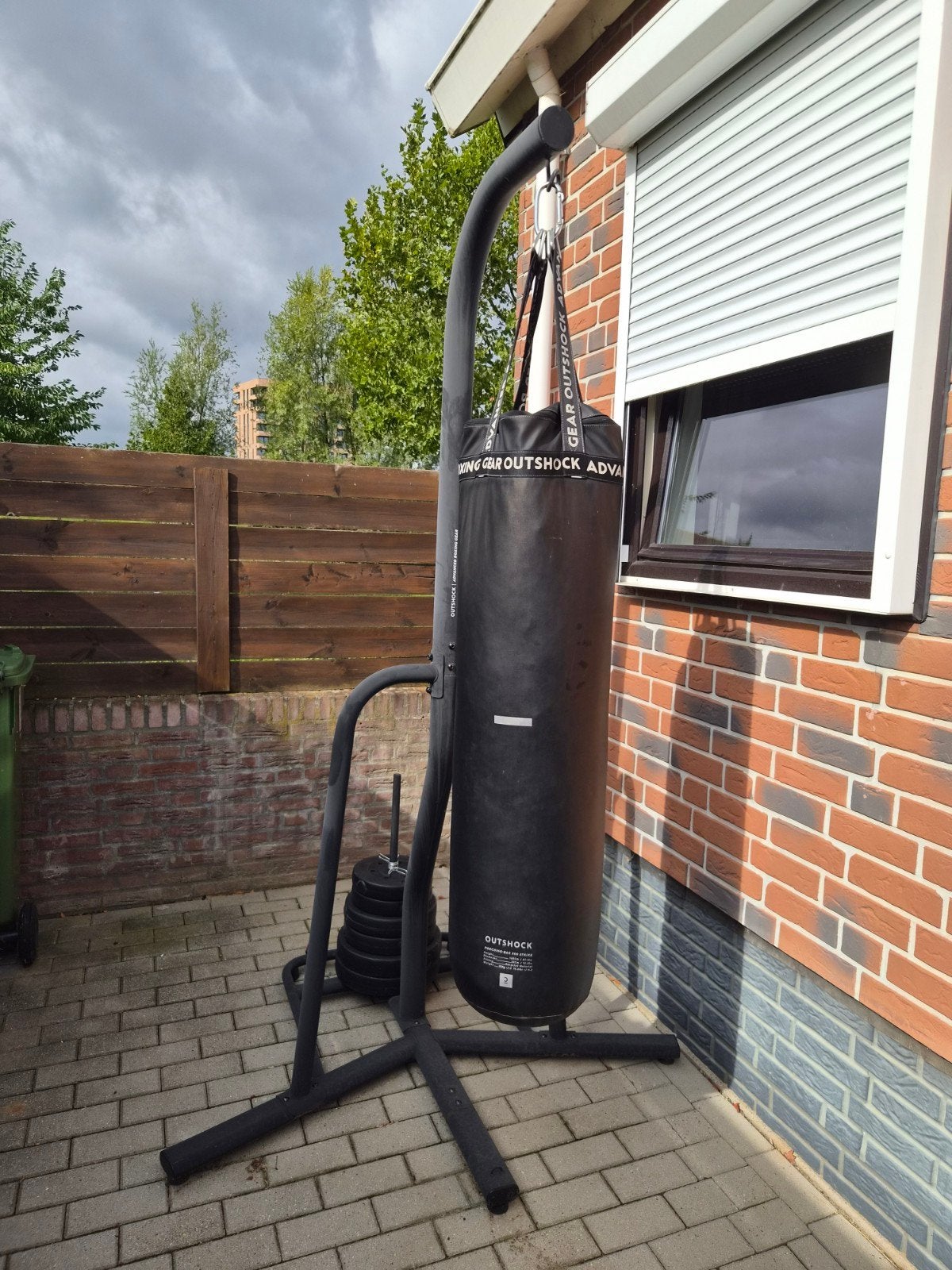 Bokszak op standaard met extra gewichten en crosstrainer, Ophalen