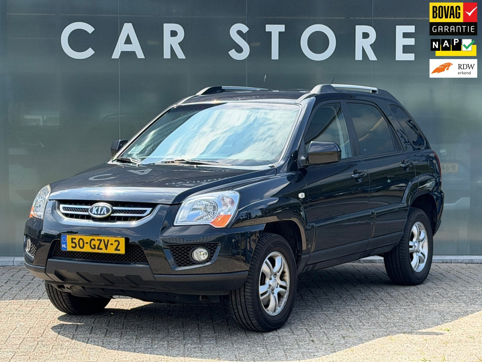 Kia Sportage 2.0 CVVT X-tra, Auto's, Kia, Stof, Gebruikt, Zwart, 4 cilinders