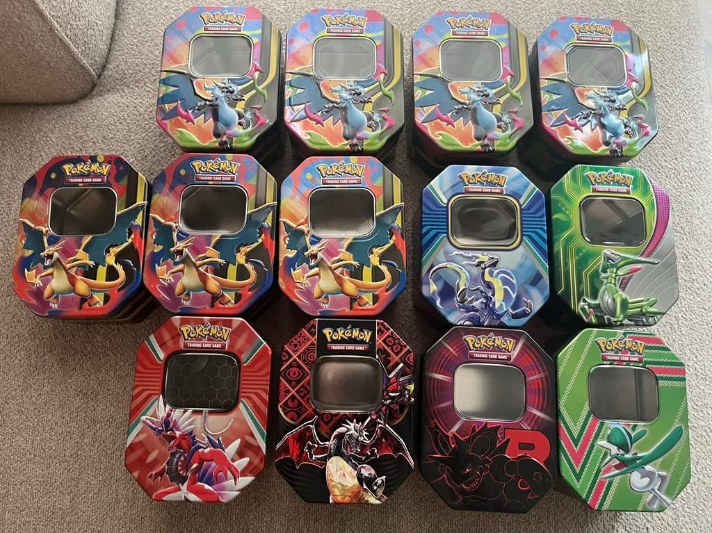 13 lege Pokémon tins / blikken – Charizard, Ophalen of Verzenden, Nieuw, Overige typen, Foil