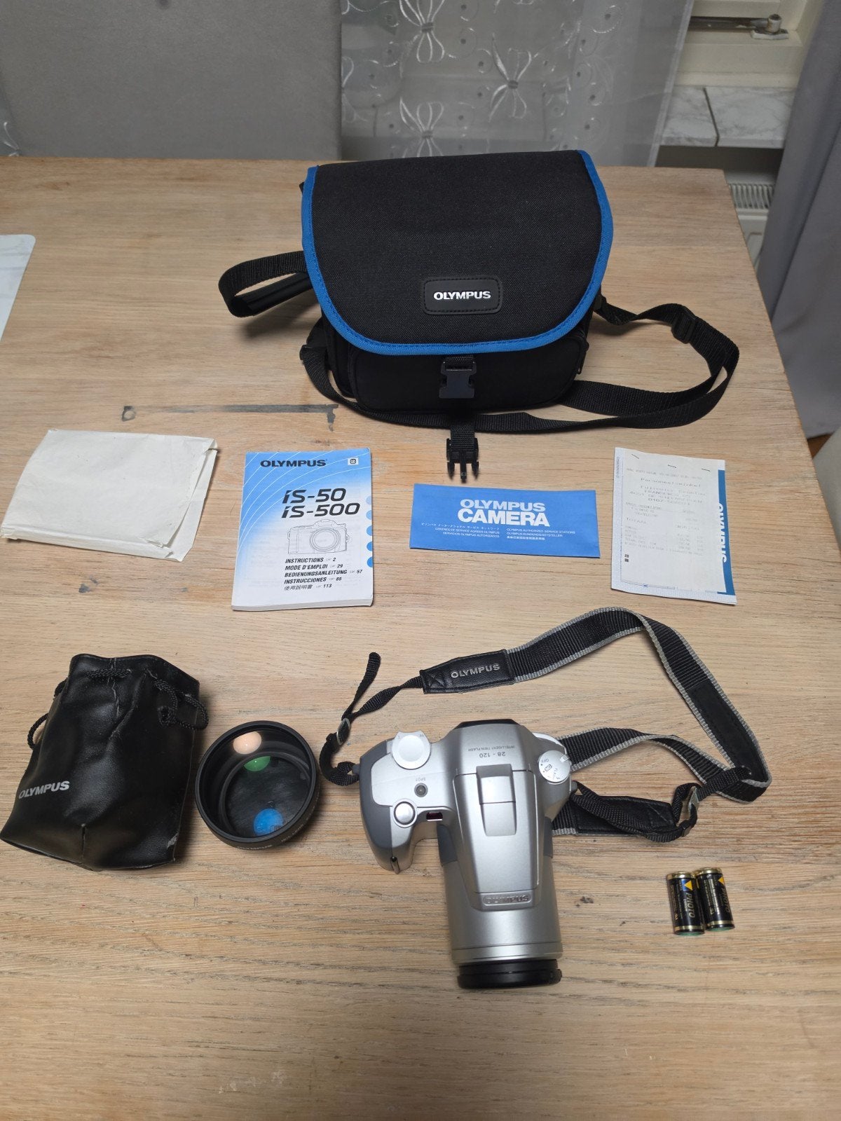 Olympus IS-500 analoge camera + teleconverter + tas – werken, Ophalen of Verzenden, Compact, Olympus