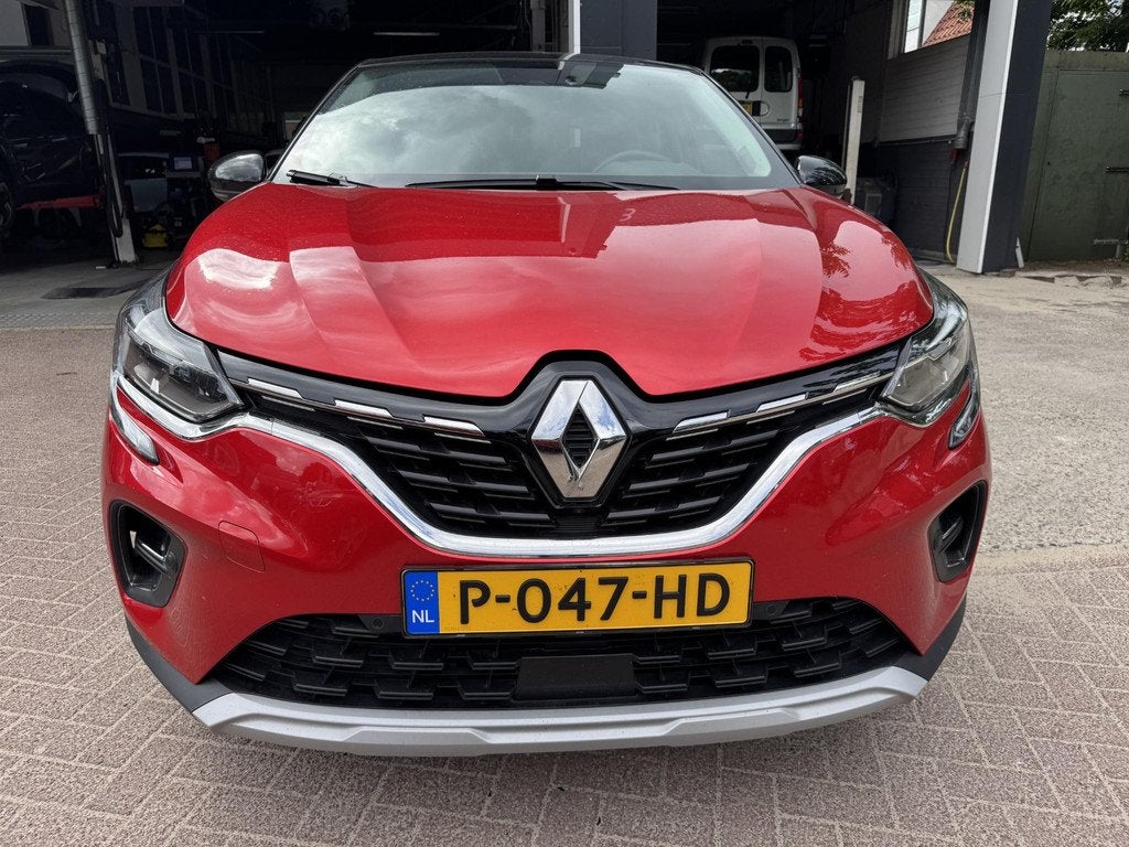 Renault Captur 1.6 E-Tech Hybrid 145 Intens+Trekhaak!, Auto's, Renault, Gebruikt, 715 kg, Leder en Stof, Bedrijf