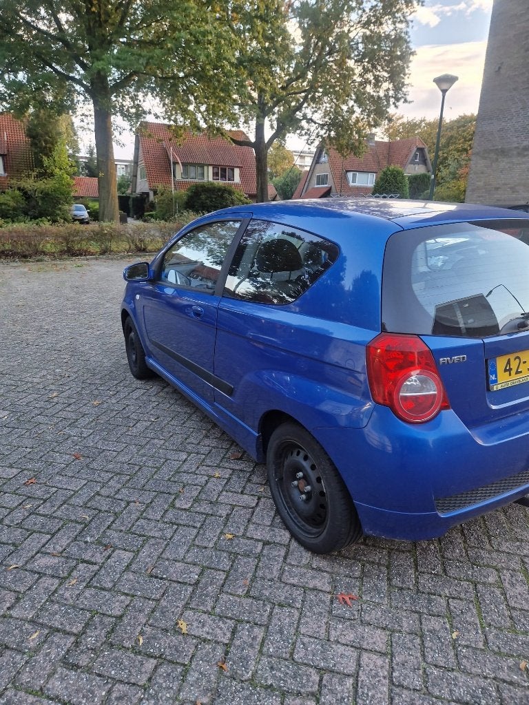 Chevrolet Aveo 1.4 16V 3D 2009 Blauw, Auto's, Voorwielaandrijving, Euro 5, Stof, 40 €/maand
