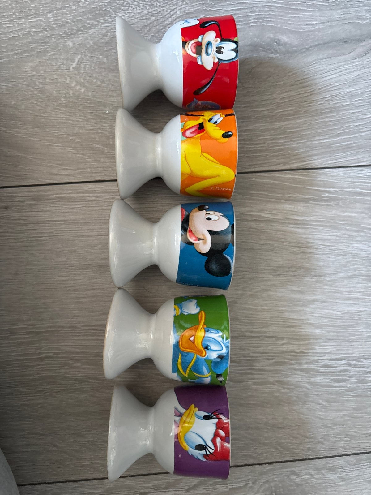 5 Disney eierdopjes - Mickey, Goofy, Pluto, Katrien, Donald, Gebruikt, Ophalen of Verzenden, Steen/keramiek, Meerkleurig