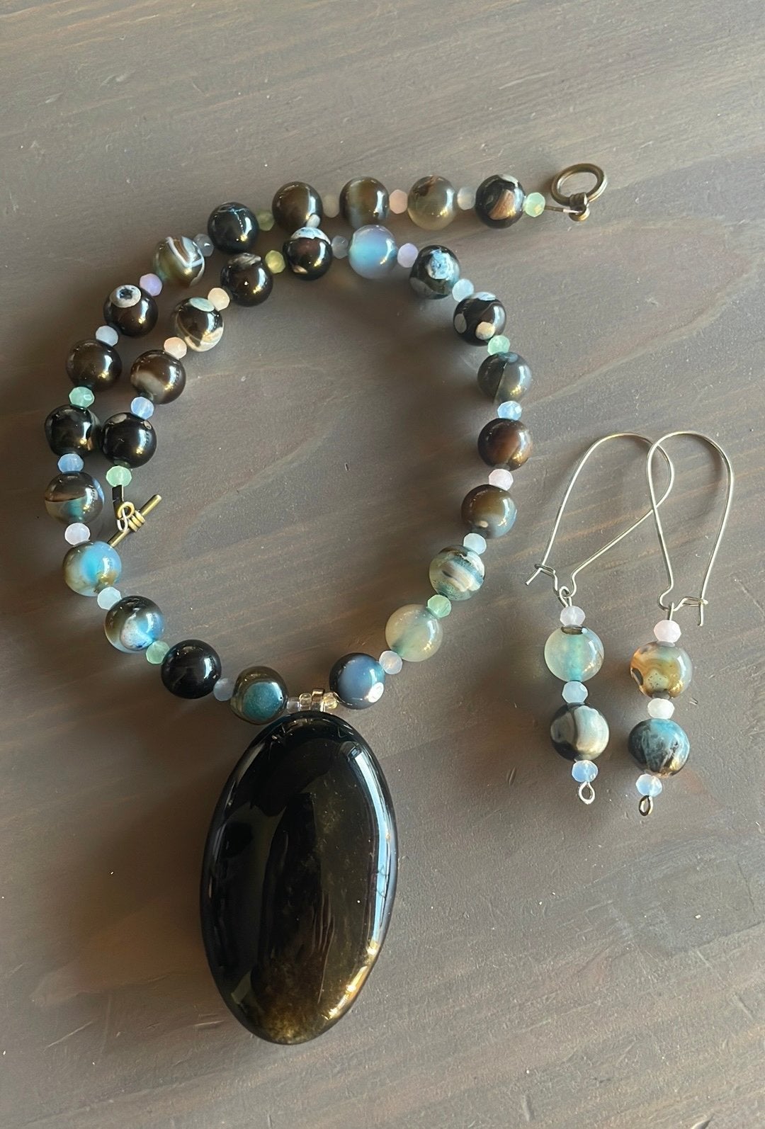 Goud flash obsediaan ketting, Sieraden, Tassen en Uiterlijk, Kettingen, Zwart, Nieuw, Ophalen of Verzenden, Steen of Mineraal