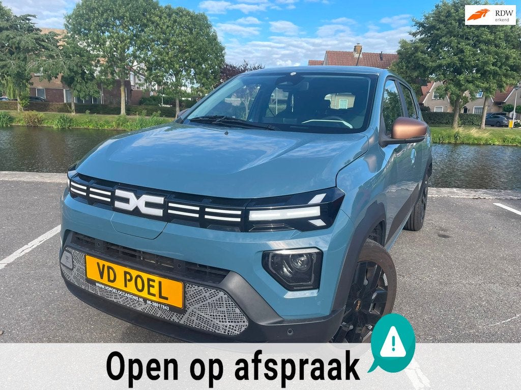 Dacia Spring Extreme 65 26.8 kWh NIEUWSTAAT NAVI AIRCO PDC, Auto's, Dacia, Gebruikt, Leder en Stof, Origineel Nederlands, 949 kg