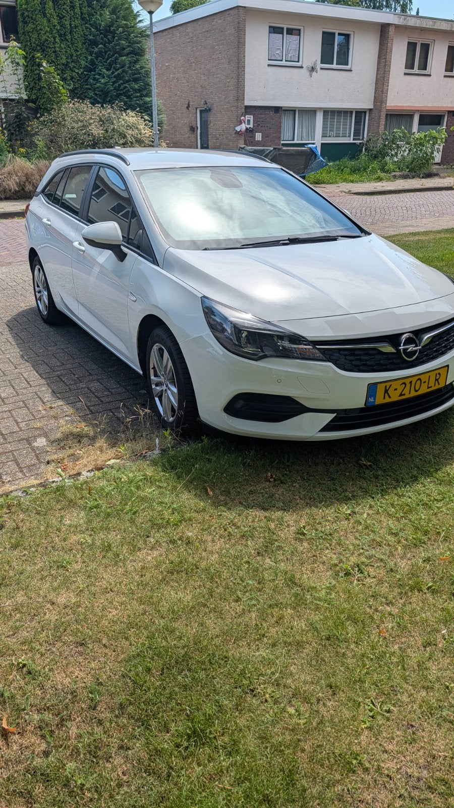 Goed onderhouden Opel Astra Sports Tourer 1.2 Turbo 110pk, Voorwielaandrijving, Stof, Zwart, Wit